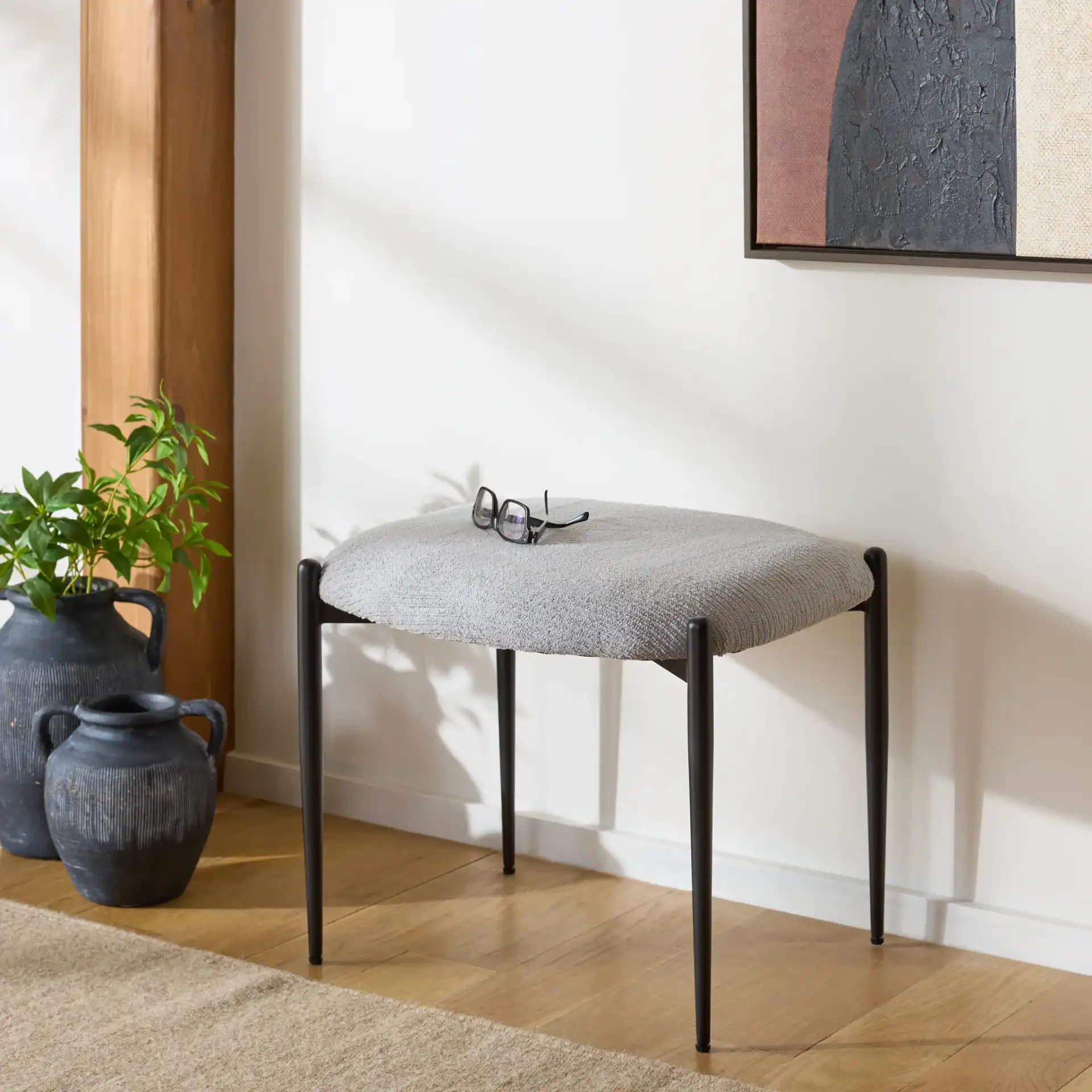 Uwe Ottoman in Gray / Black in a styled room