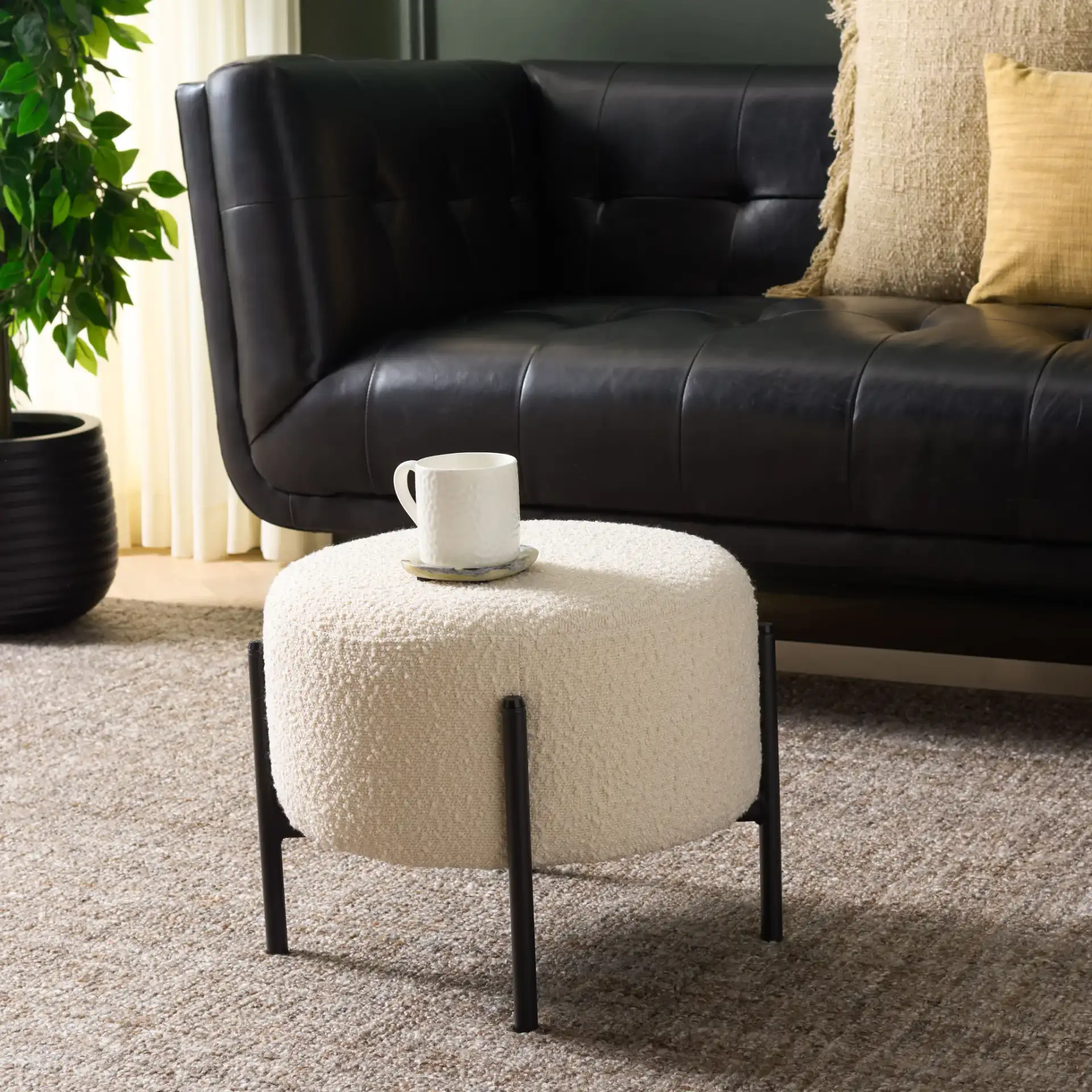 Crius Ottoman in Cream / Black in a styled room