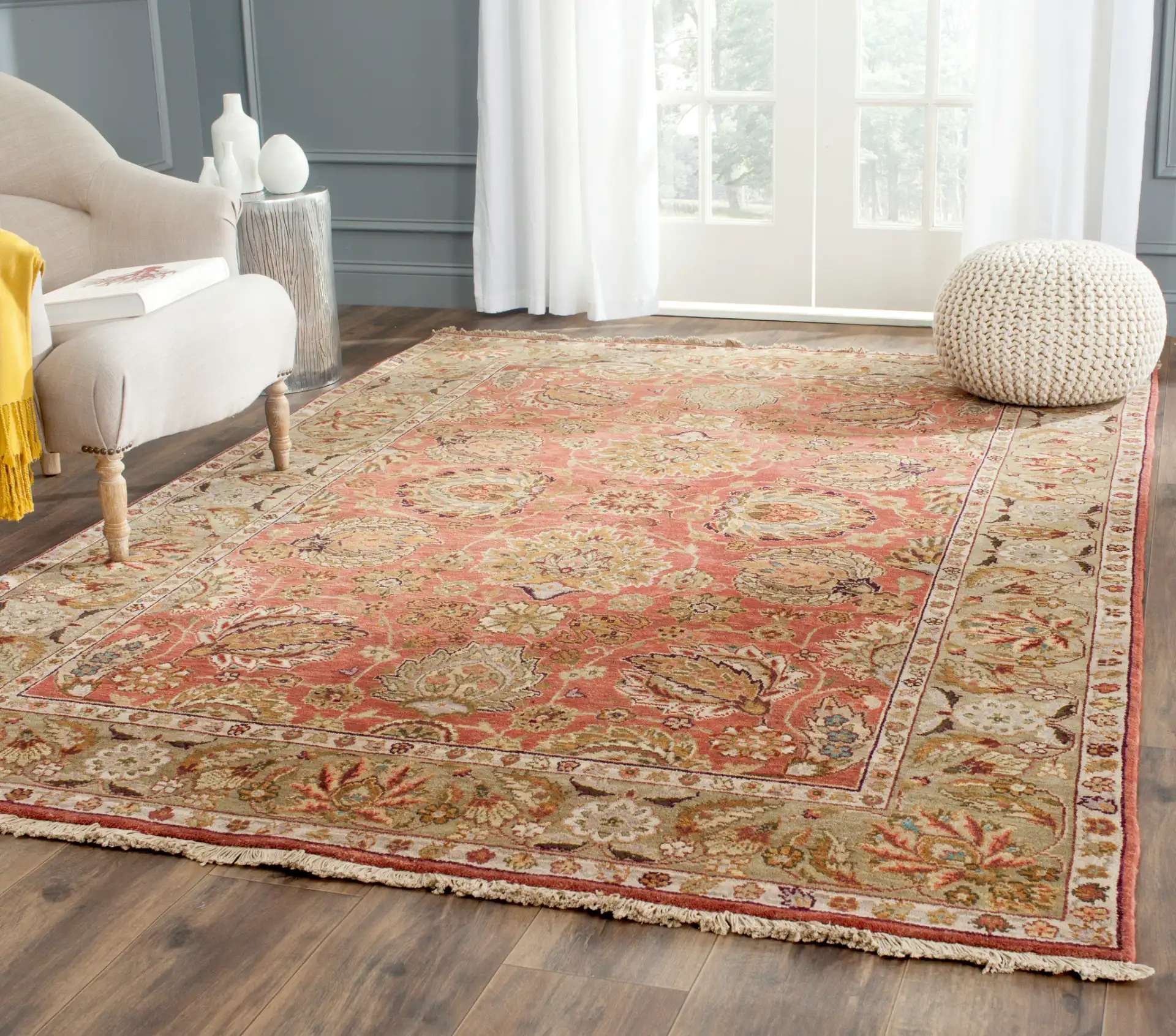 Old World Palmette Leaf Bordered Wool Rug in Copper / Green in a styled room