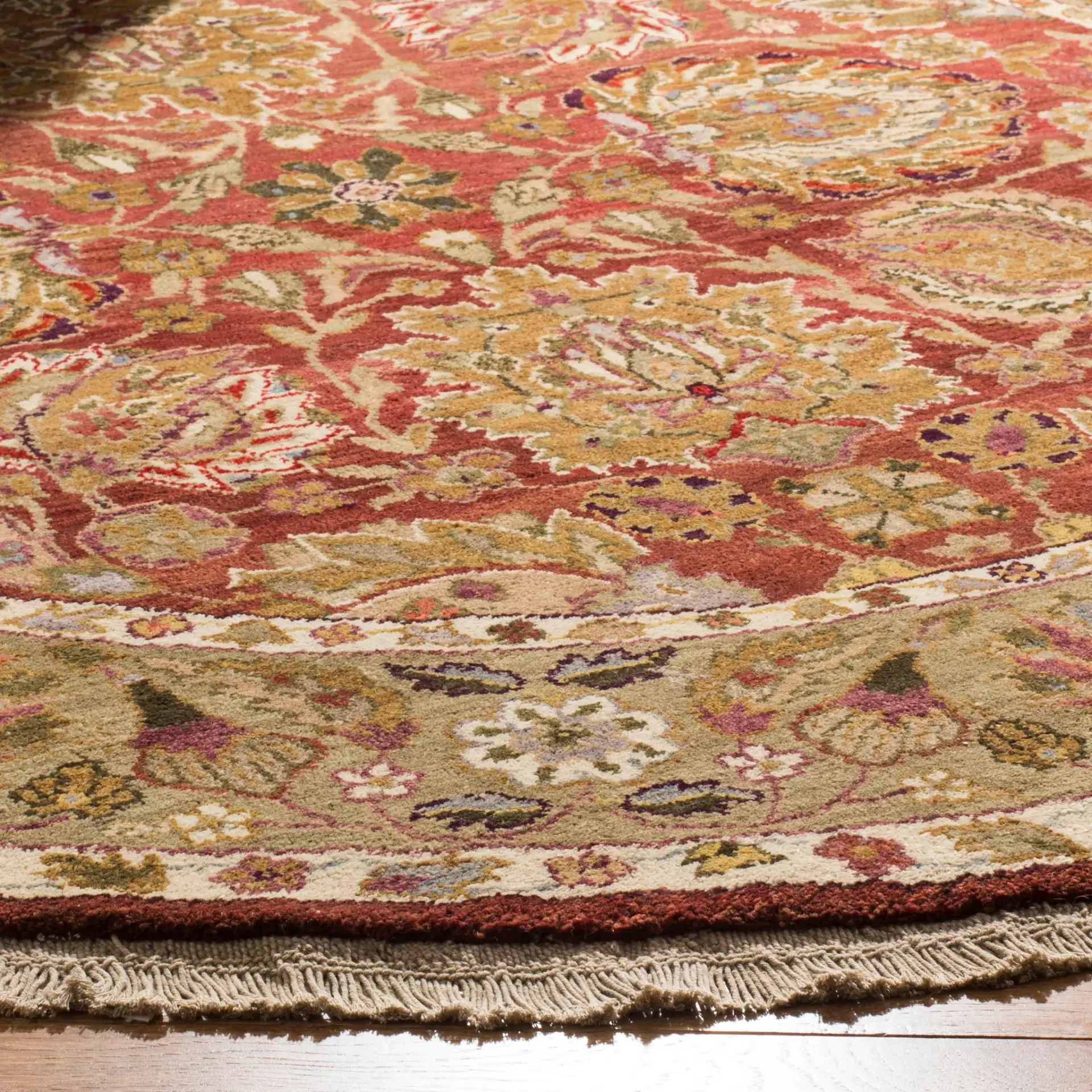 Old World Palmette Leaf Bordered Wool Rug in Copper / Green in a styled room