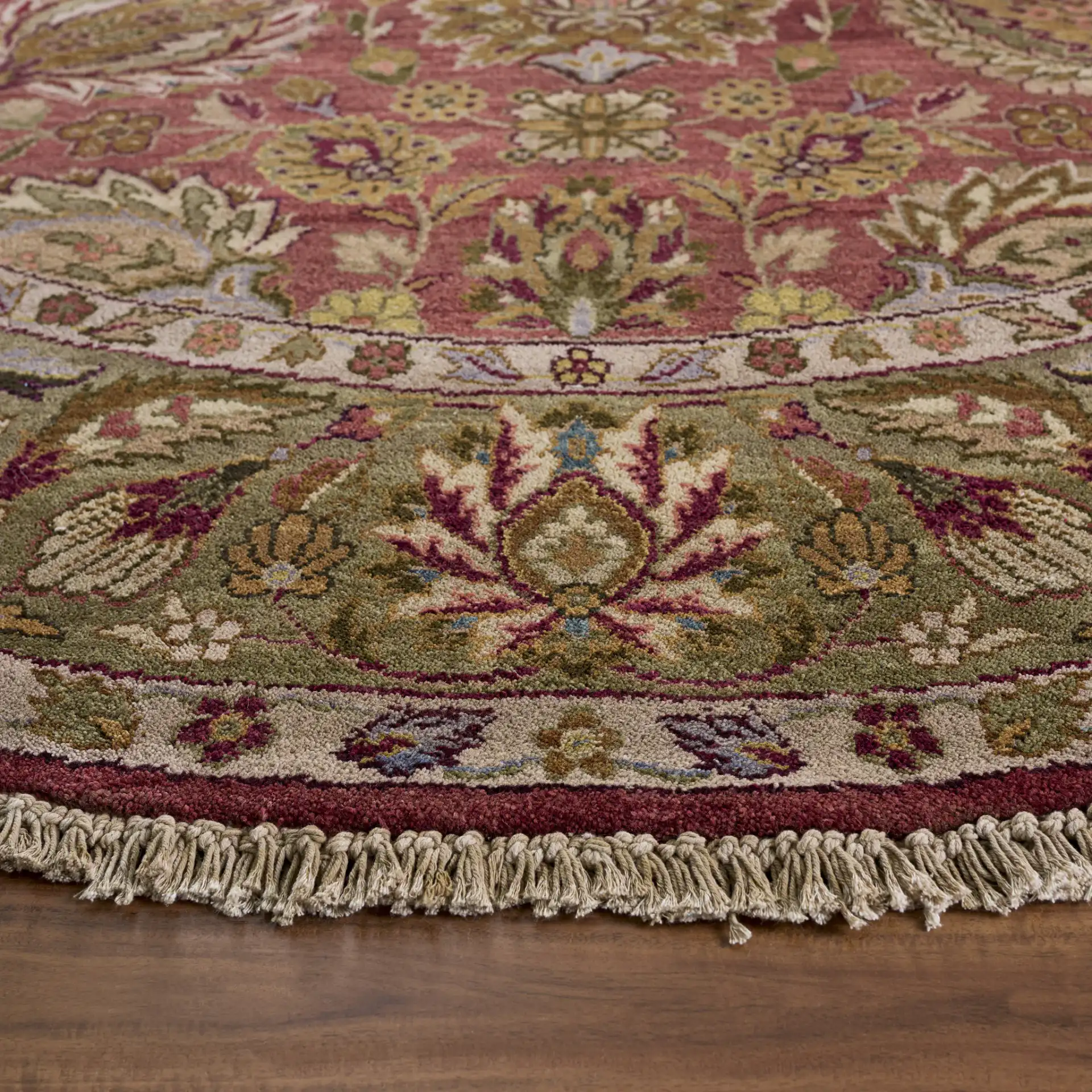 Old World Palmette Leaf Bordered Wool Rug in Copper / Green in a styled room