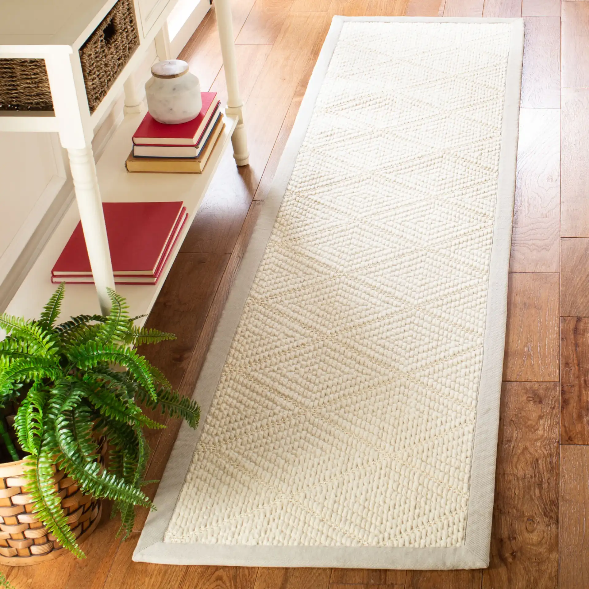 Palm Beach Bordered Diamond Rug in Ivory / Gray in a styled room