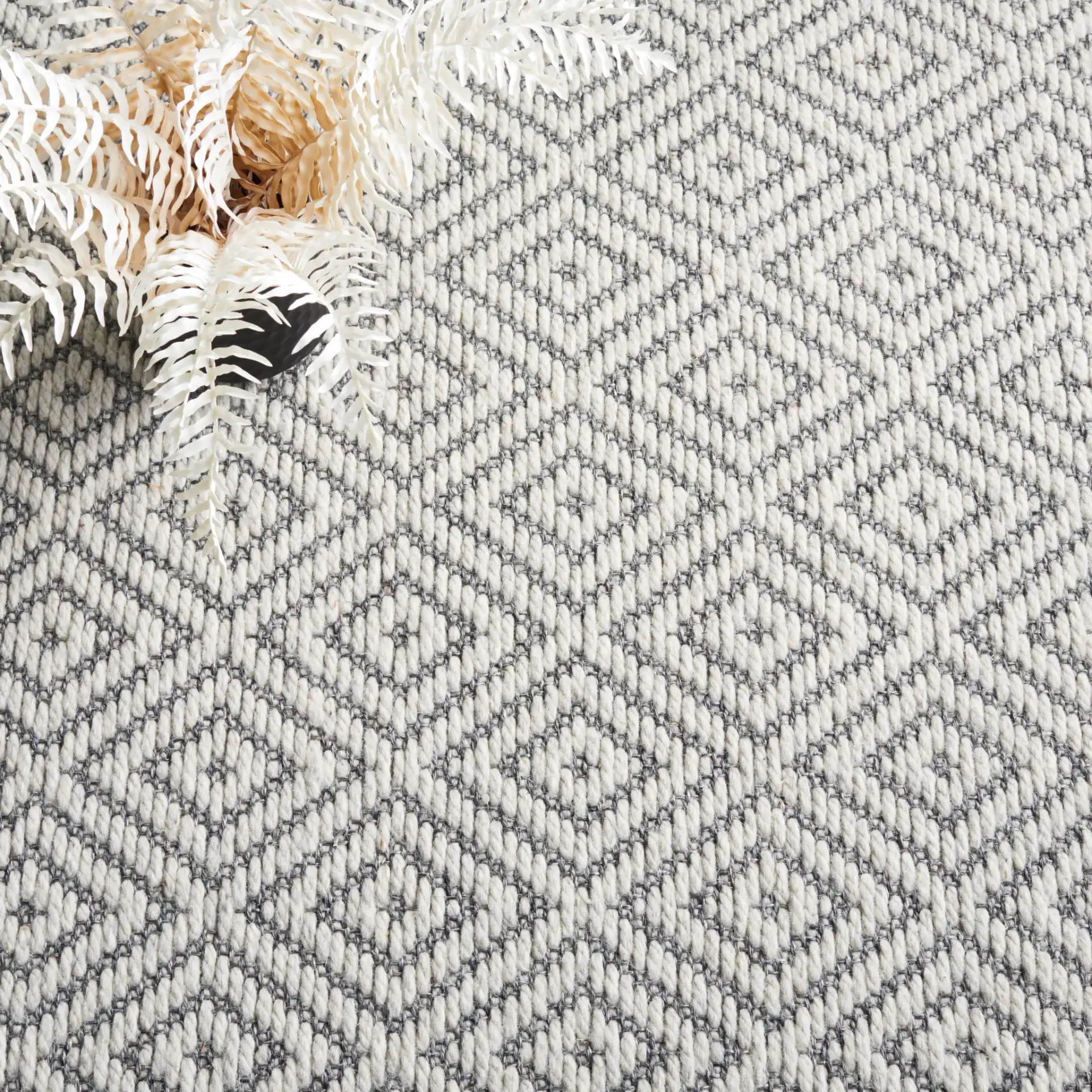 Palm Beach Nested Diamond Rug in Gray / Dark Gray in a styled room