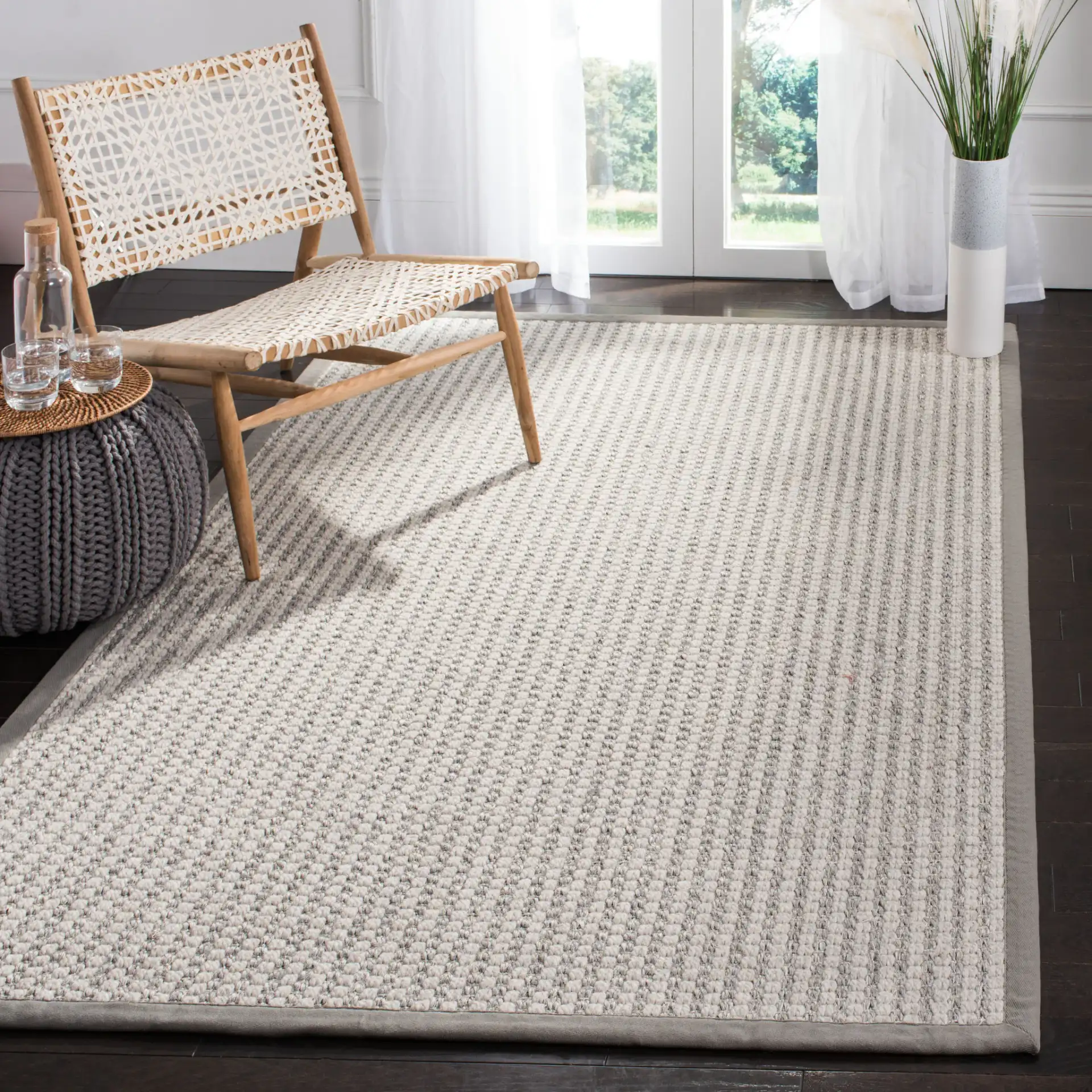 Palm Beach Solid Bordered Rug in Silver / Ivory in a styled room