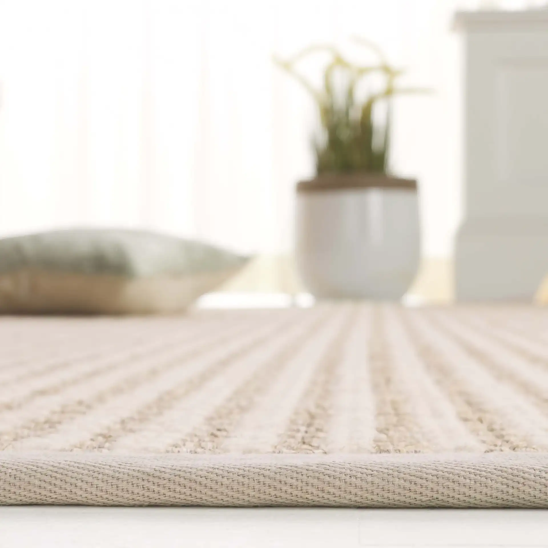 Palm Beach Waffle Bordered Rug in Ivory in a styled room