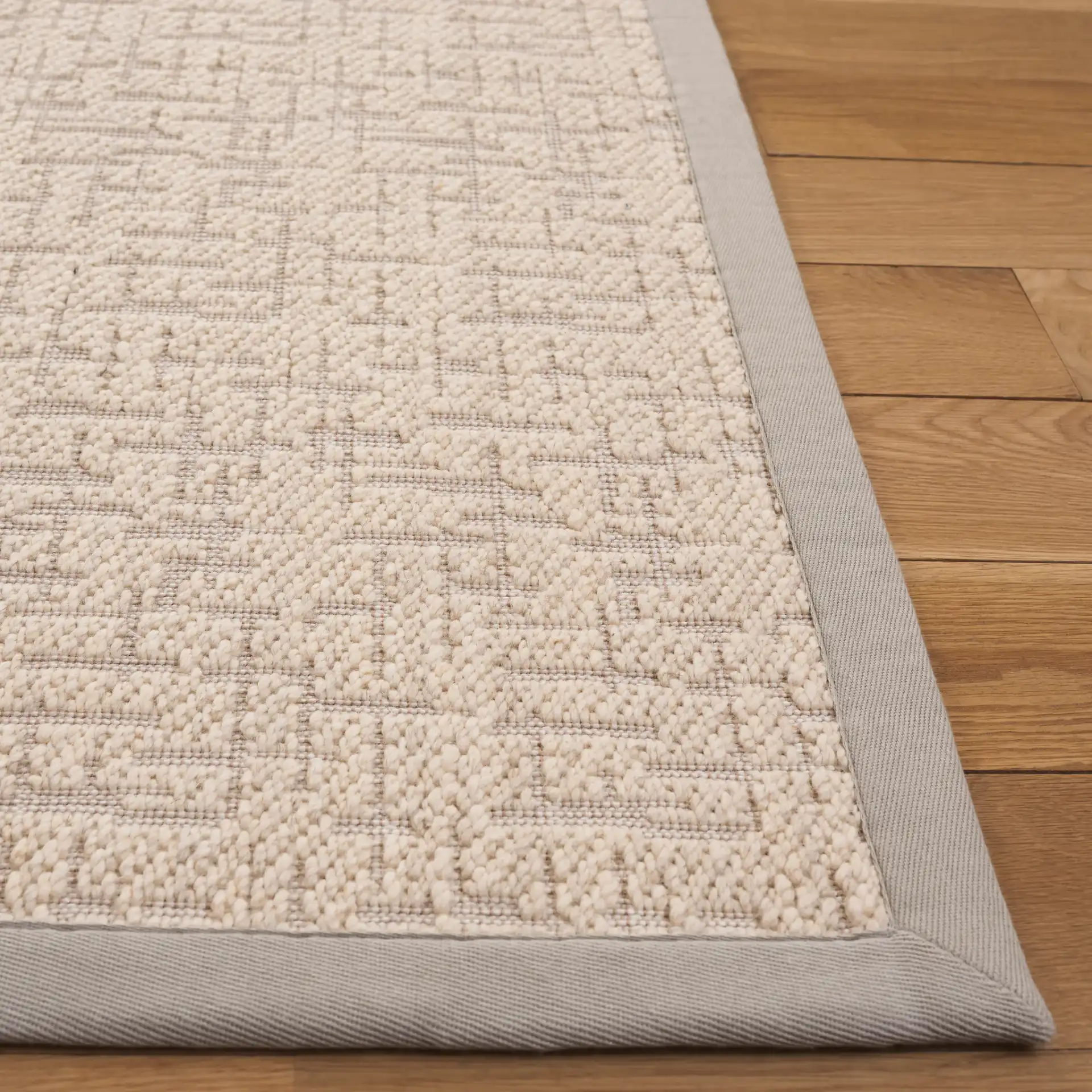Cottage Bordered Basketweave Wool Rug in Ivory in a styled room