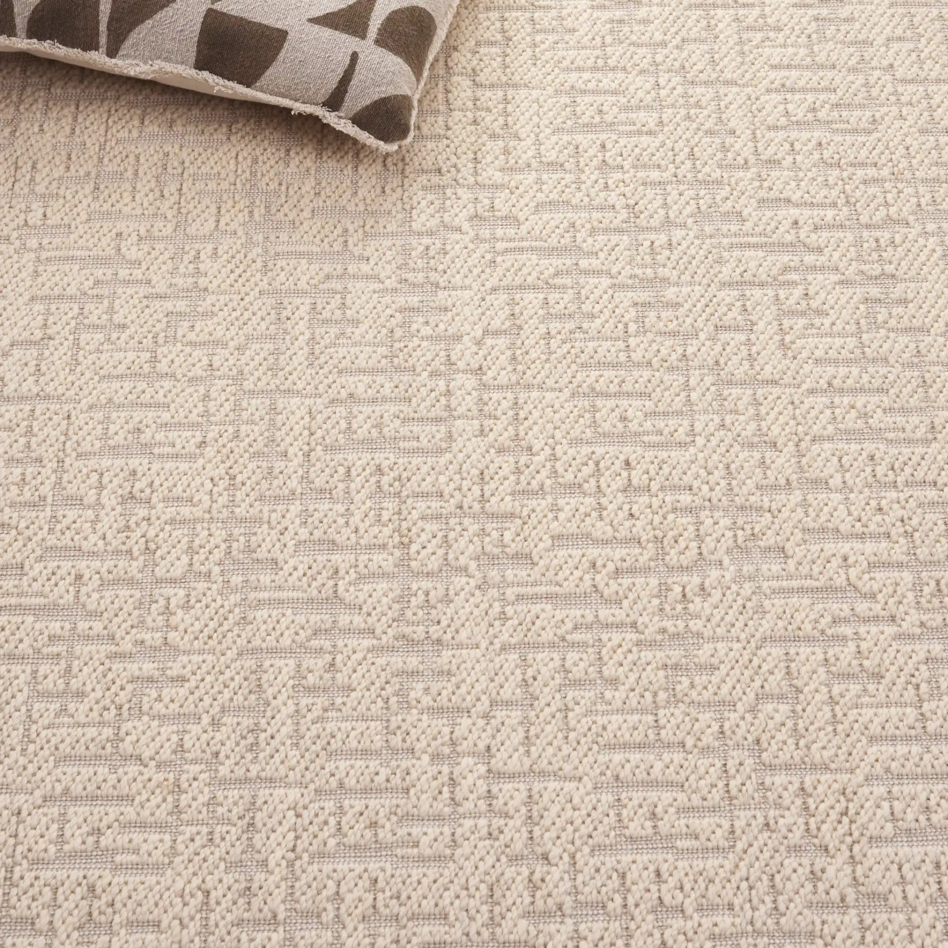 Cottage Bordered Basketweave Wool Rug in Ivory in a styled room
