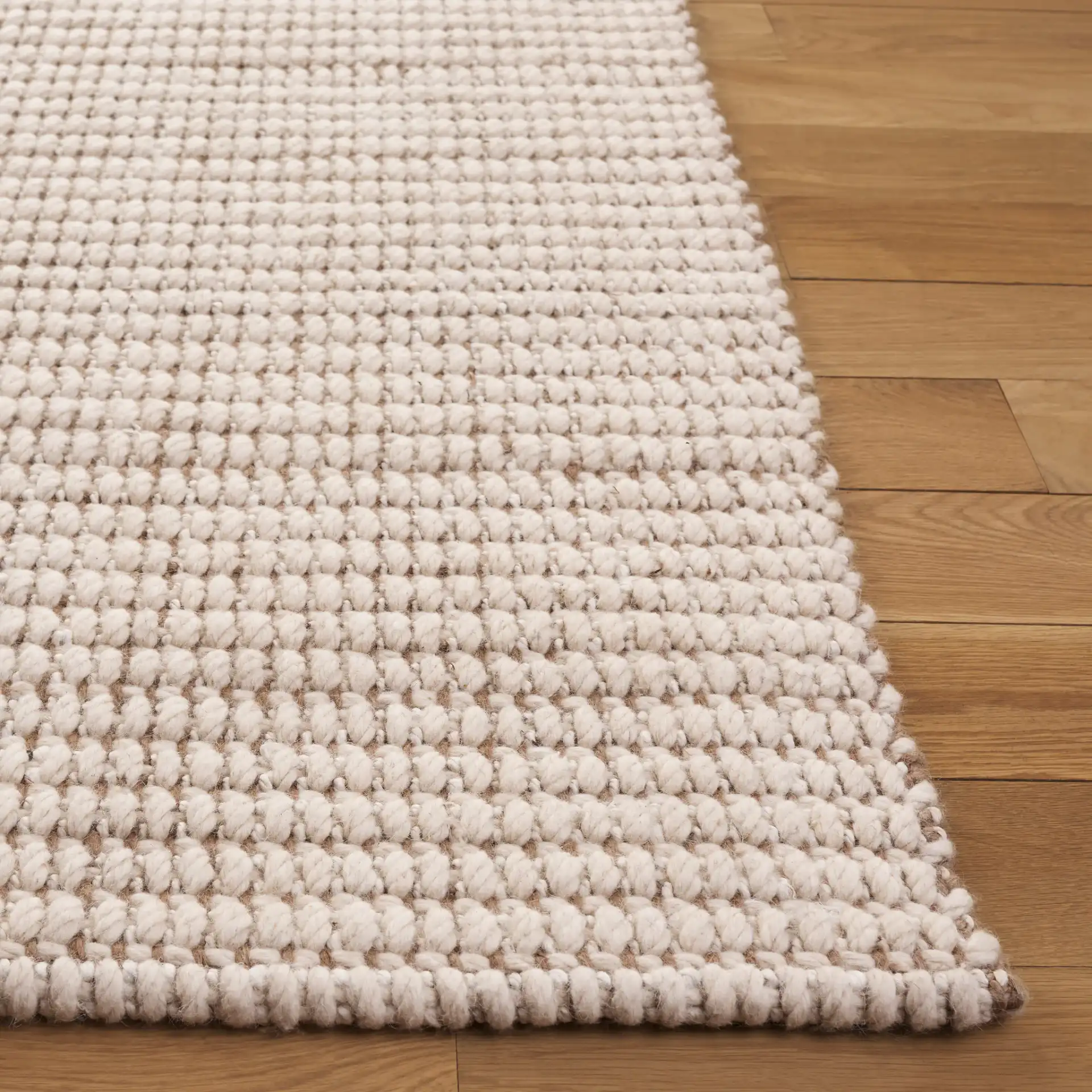 Grid Ribbed Rug in Ivory / Natural in a styled room