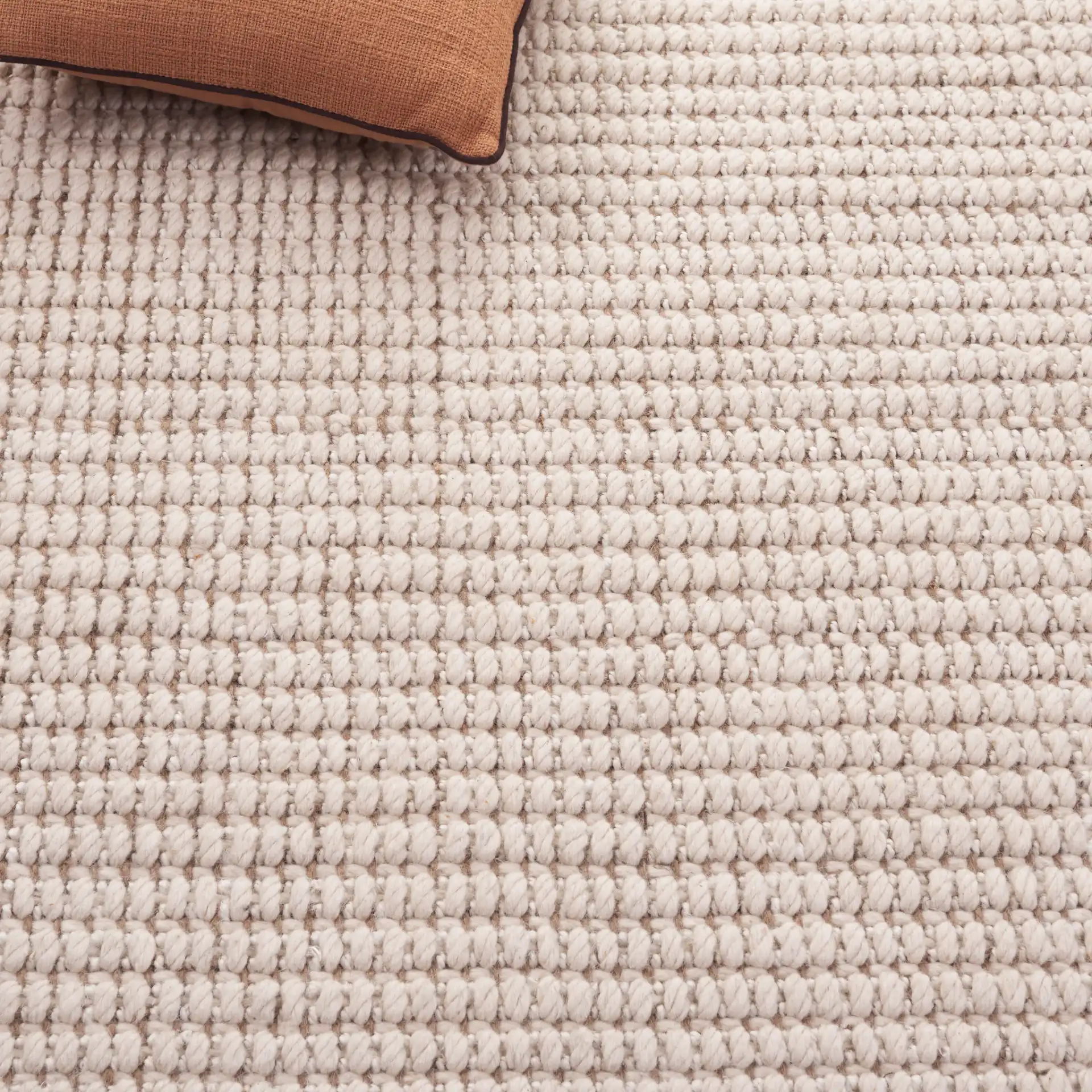 Grid Ribbed Rug in Ivory / Natural in a styled room