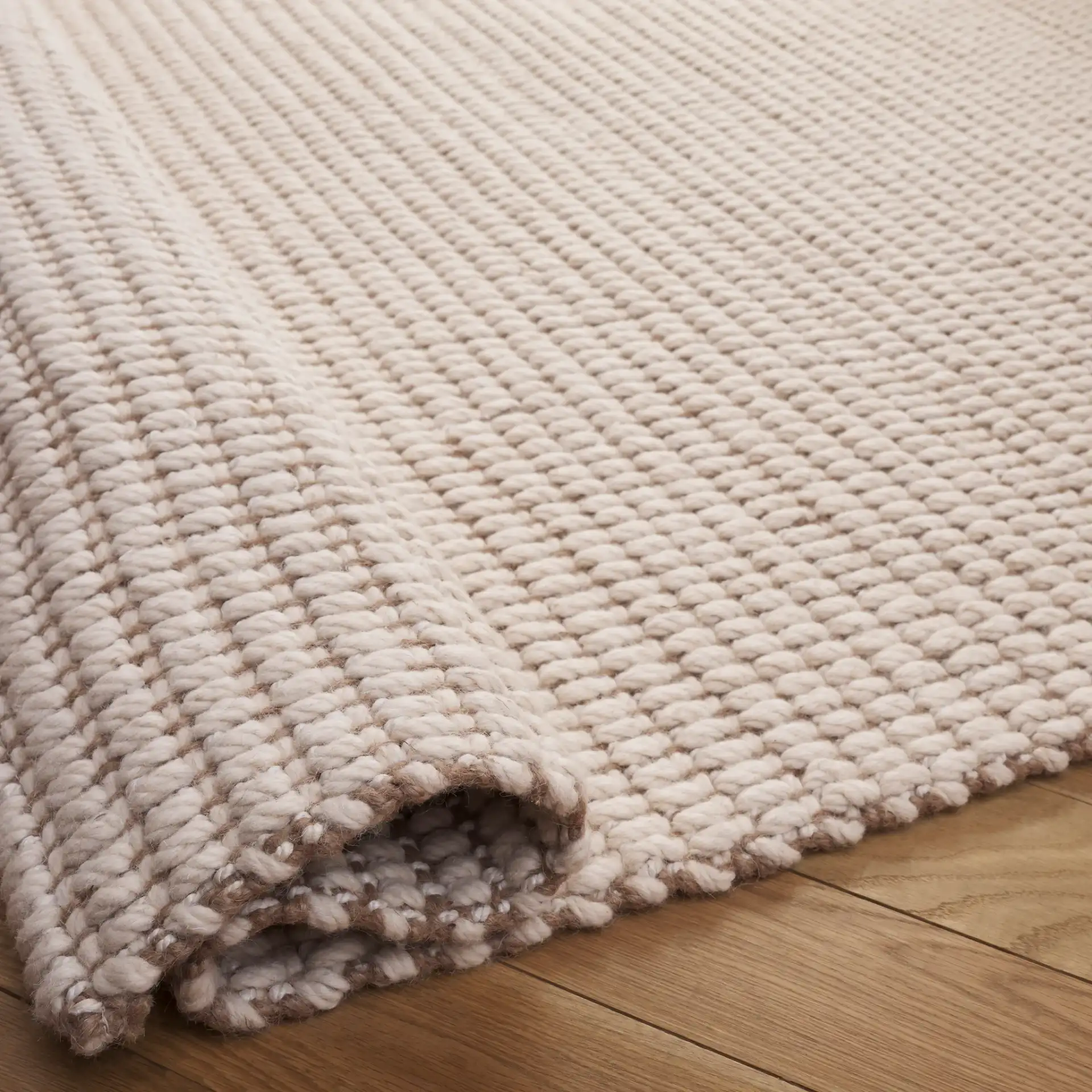 Grid Ribbed Rug in Ivory / Natural in a styled room