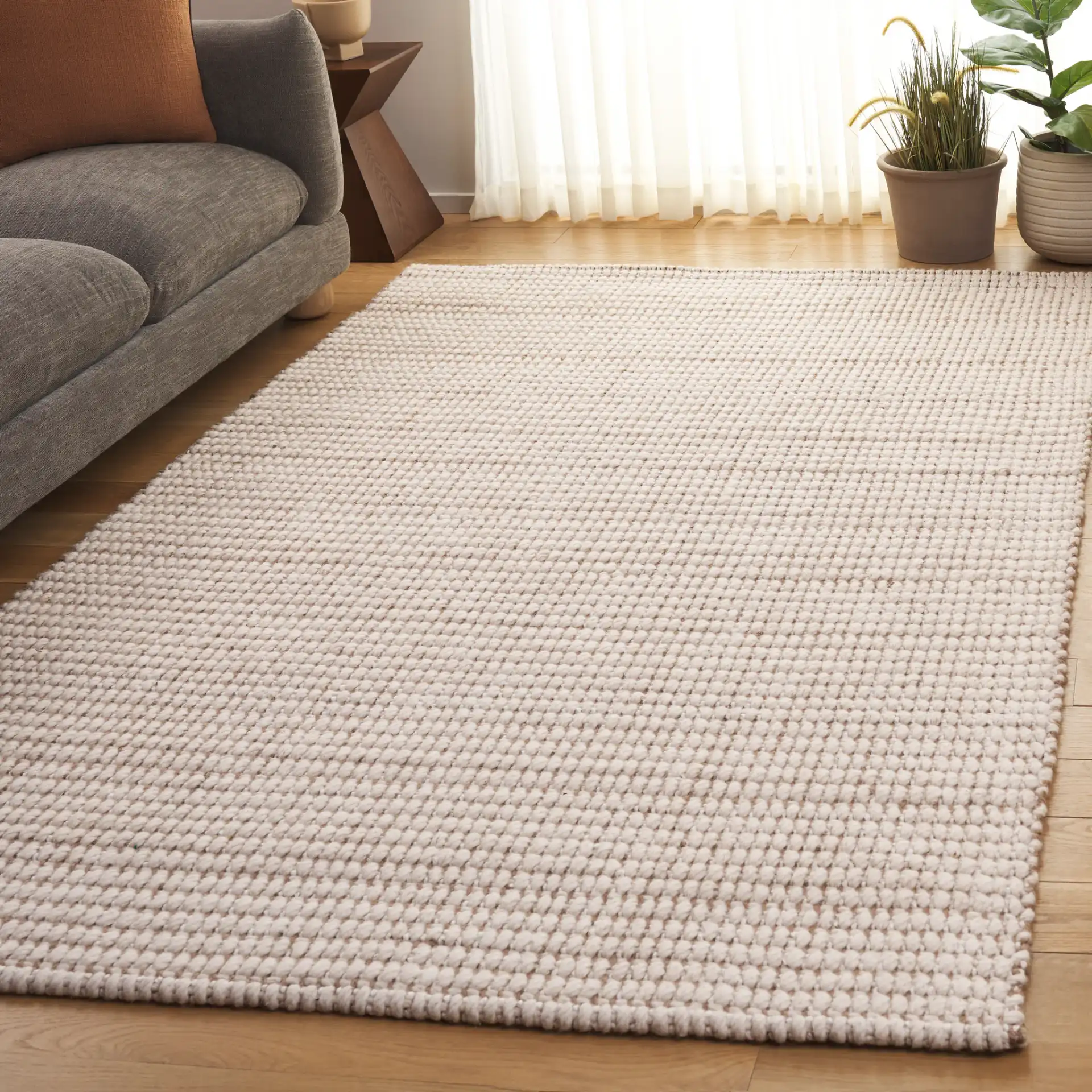 Grid Ribbed Rug in Ivory / Natural in a styled room