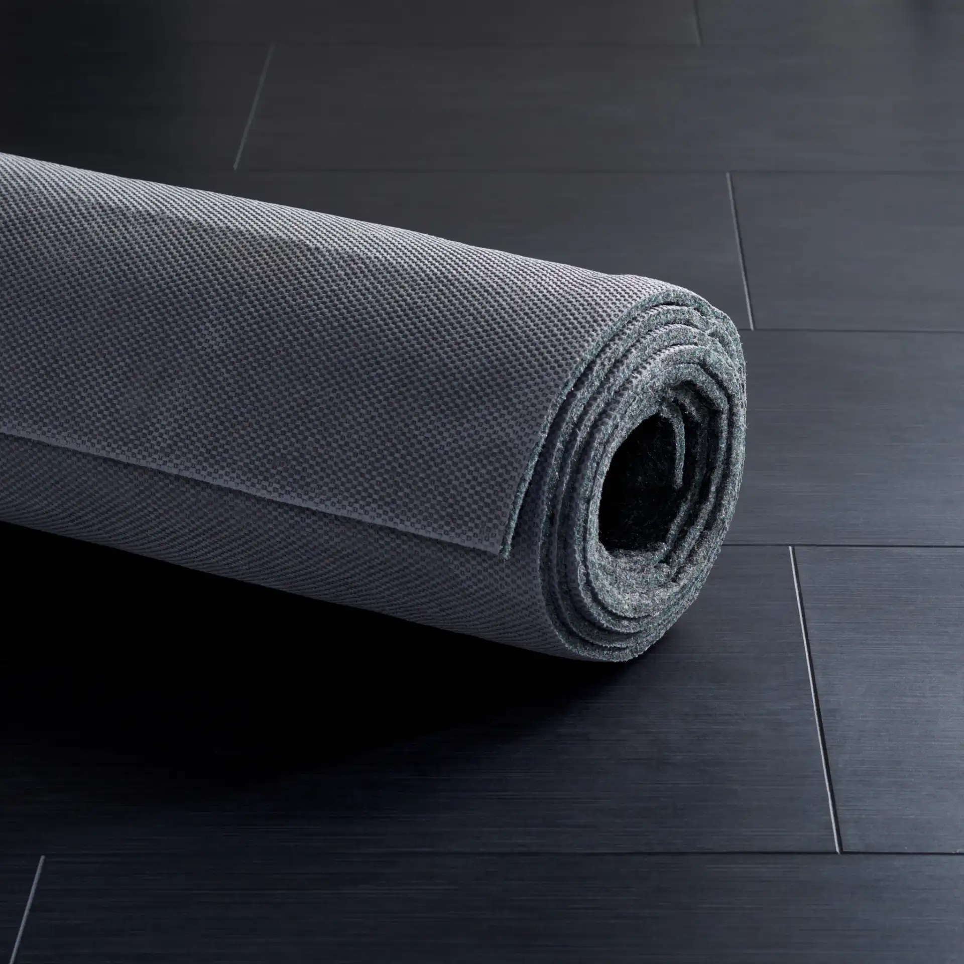 Dura Solid Rug Pad in Gray in a styled room