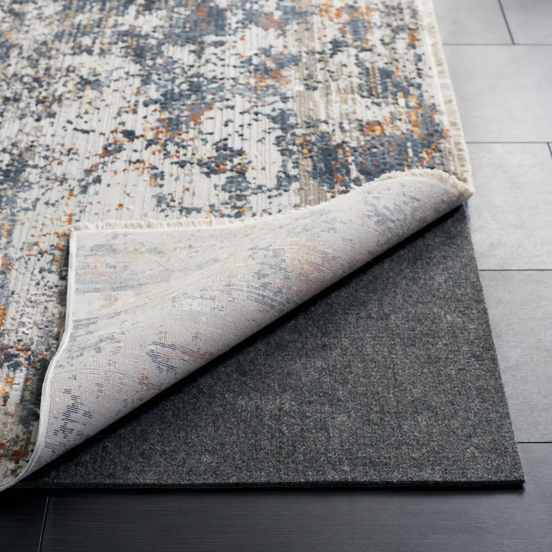 Dura Solid Rug Pad in Gray in a styled room
