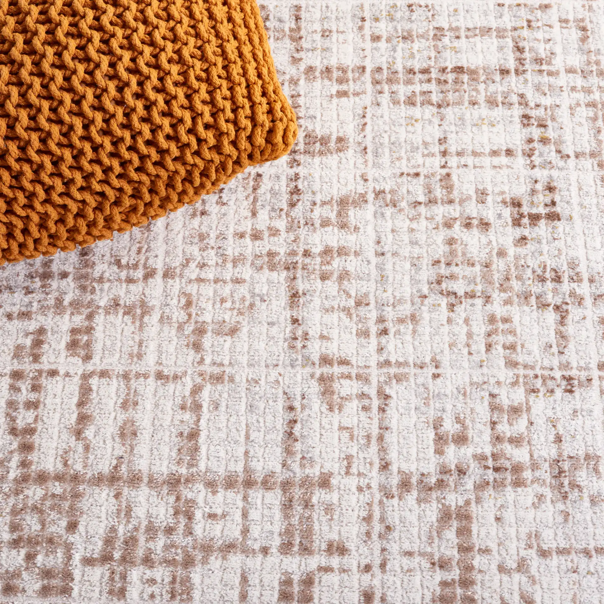 Palma Textured Grid Rug in Beige / Brown in a styled room
