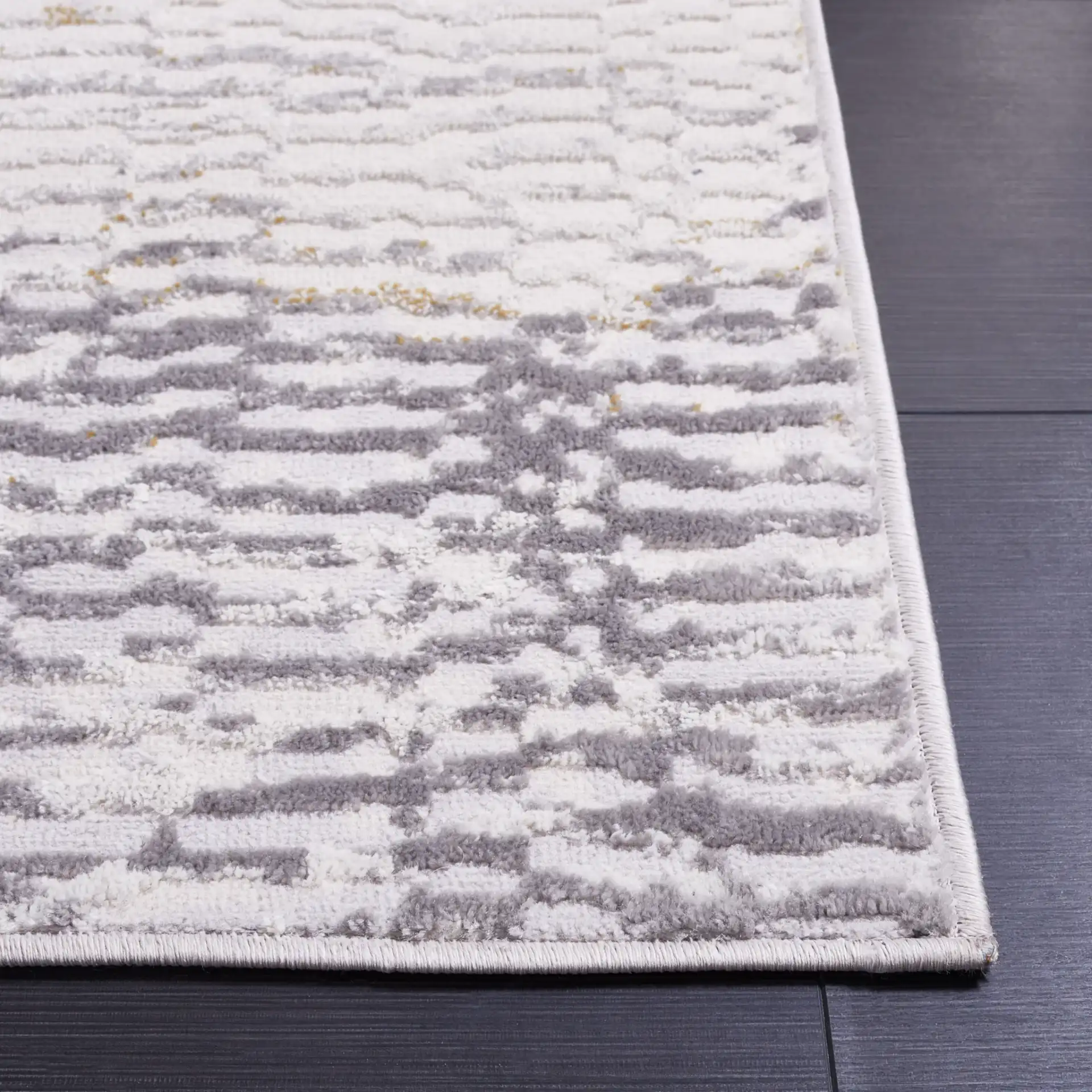Palma Faded Abstract Rug in Beige / Light Gray in a styled room