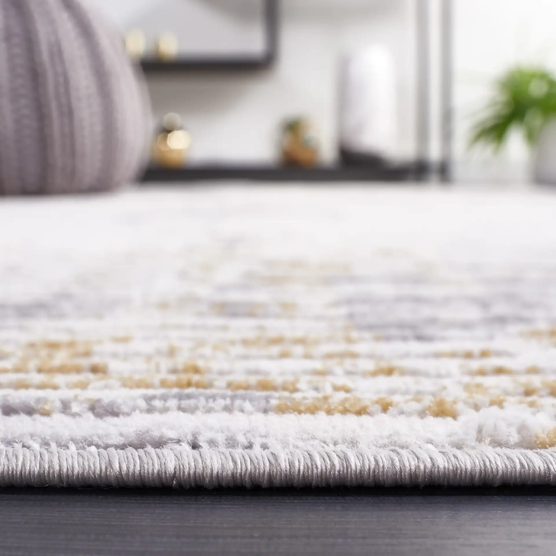 Palma Faded Abstract Rug in Beige / Light Gray in a styled room