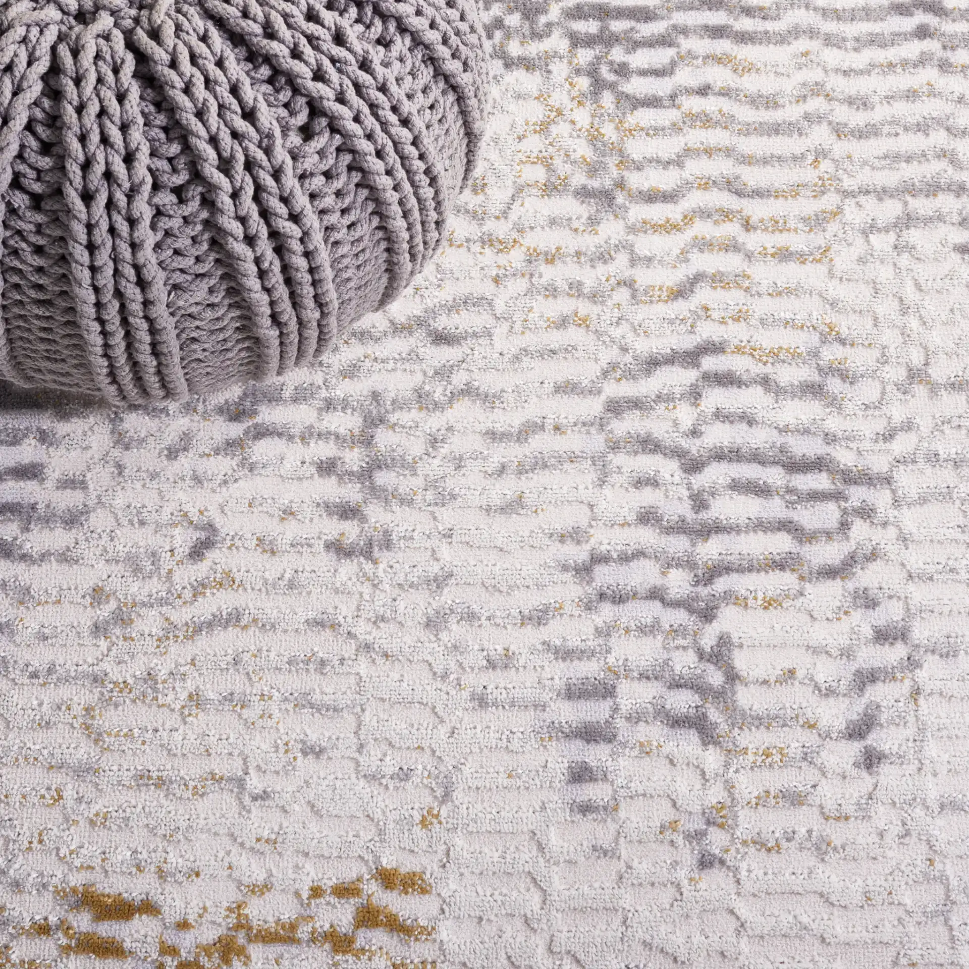 Palma Faded Abstract Rug in Beige / Light Gray in a styled room
