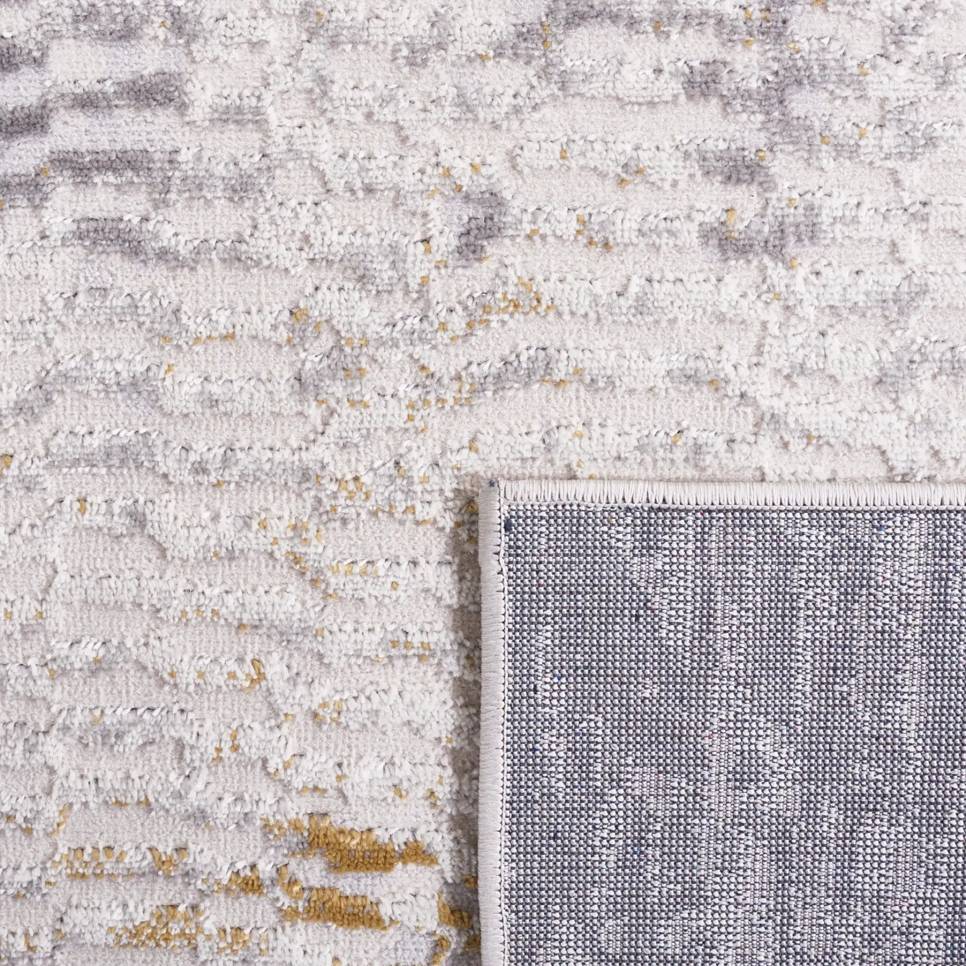Palma Faded Abstract Rug in Beige / Light Gray in a styled room