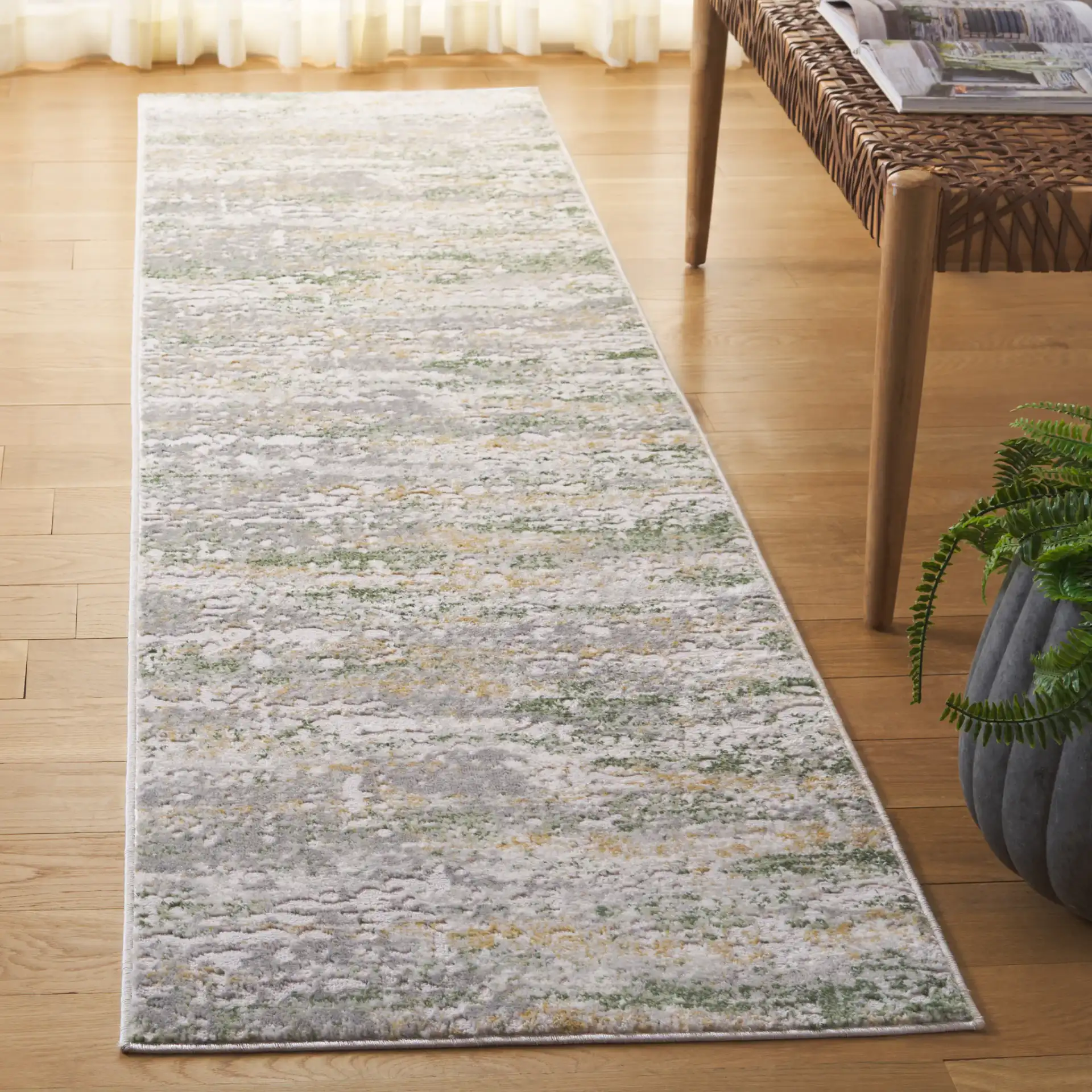 Palma Distressed Abstract Rug in Gray / Green in a styled room