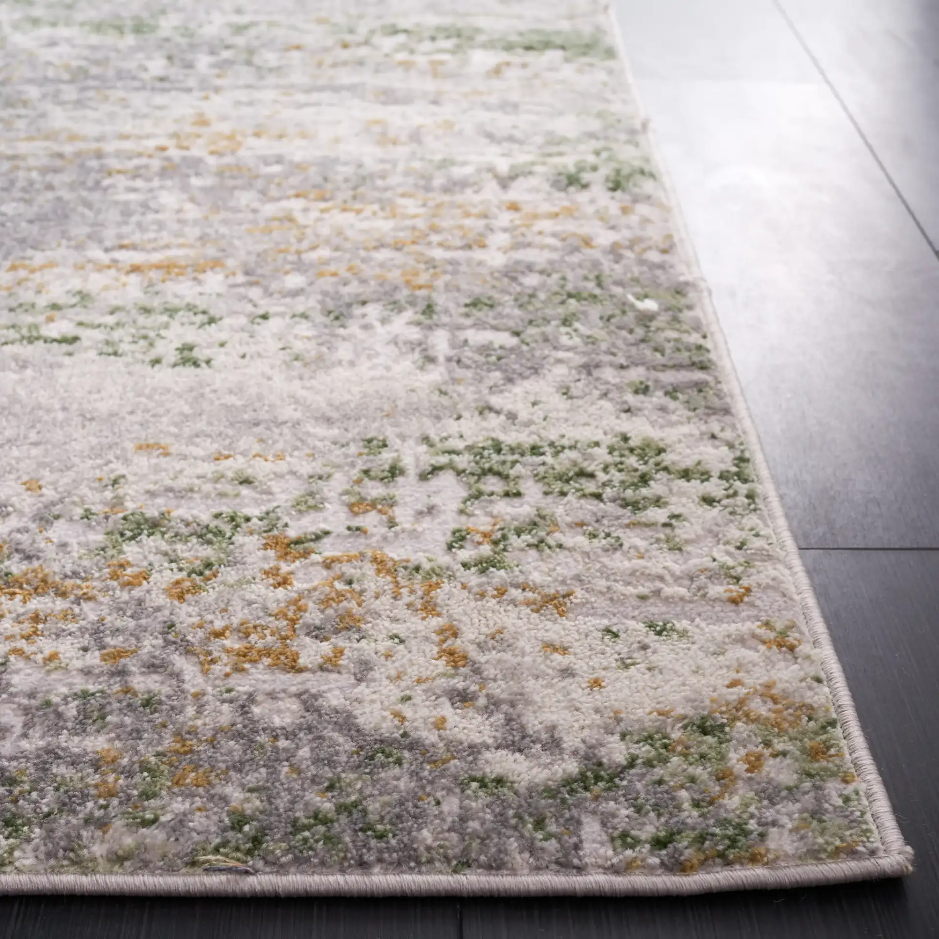 Palma Distressed Abstract Rug in Gray / Green in a styled room