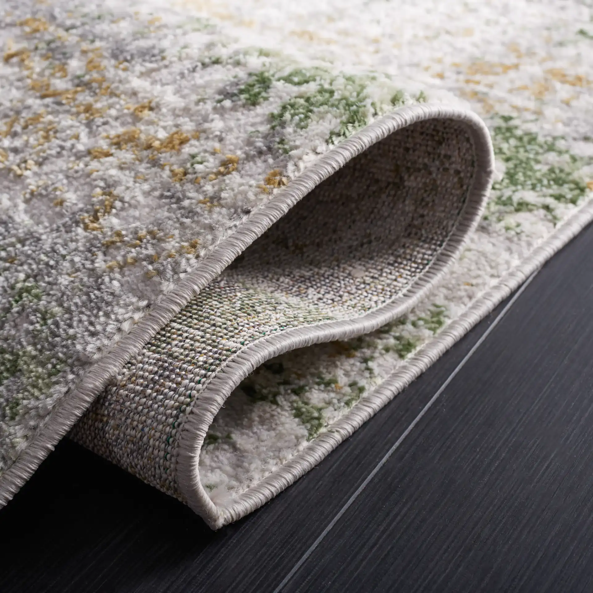 Palma Distressed Abstract Rug in Gray / Green in a styled room
