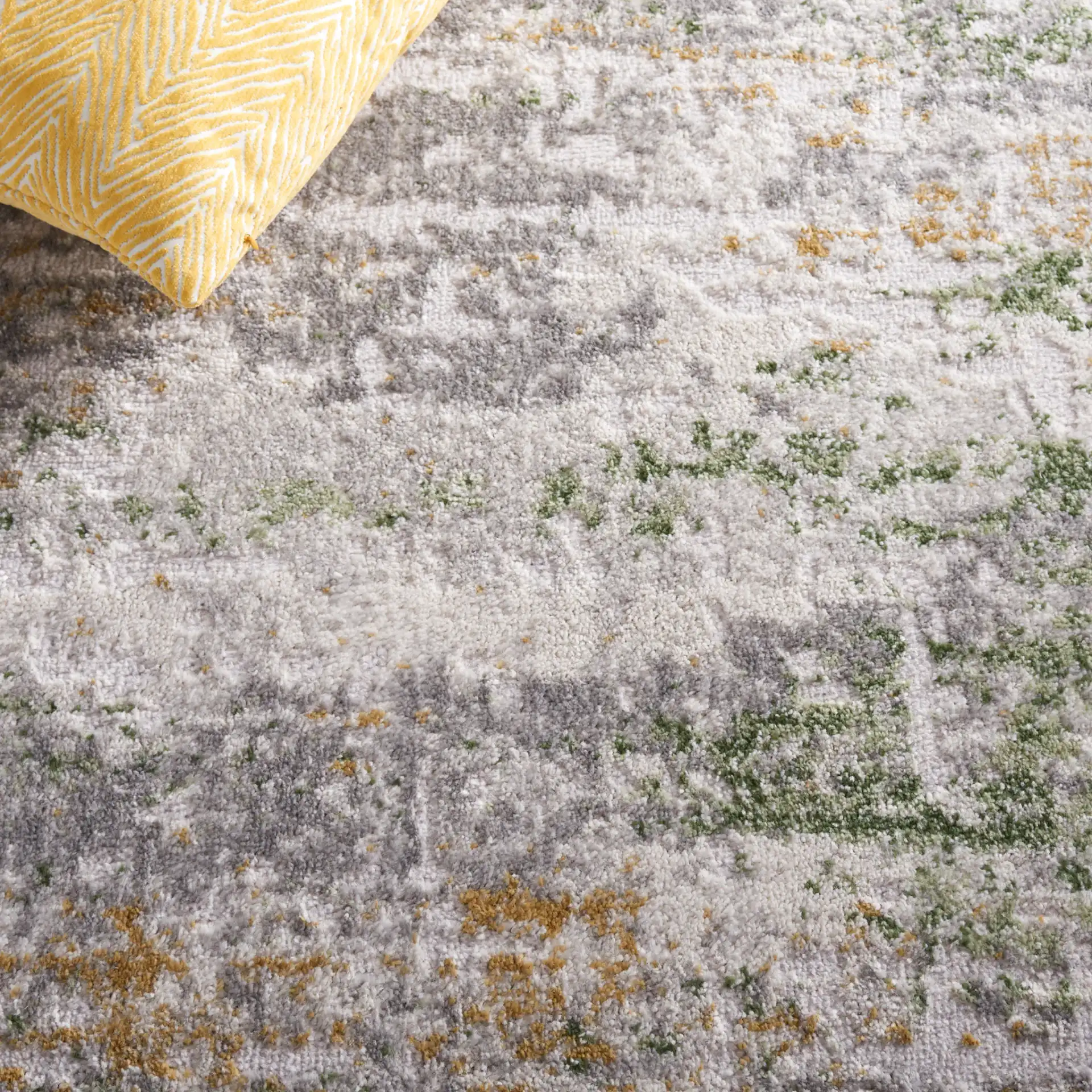 Palma Distressed Abstract Rug in Gray / Green in a styled room