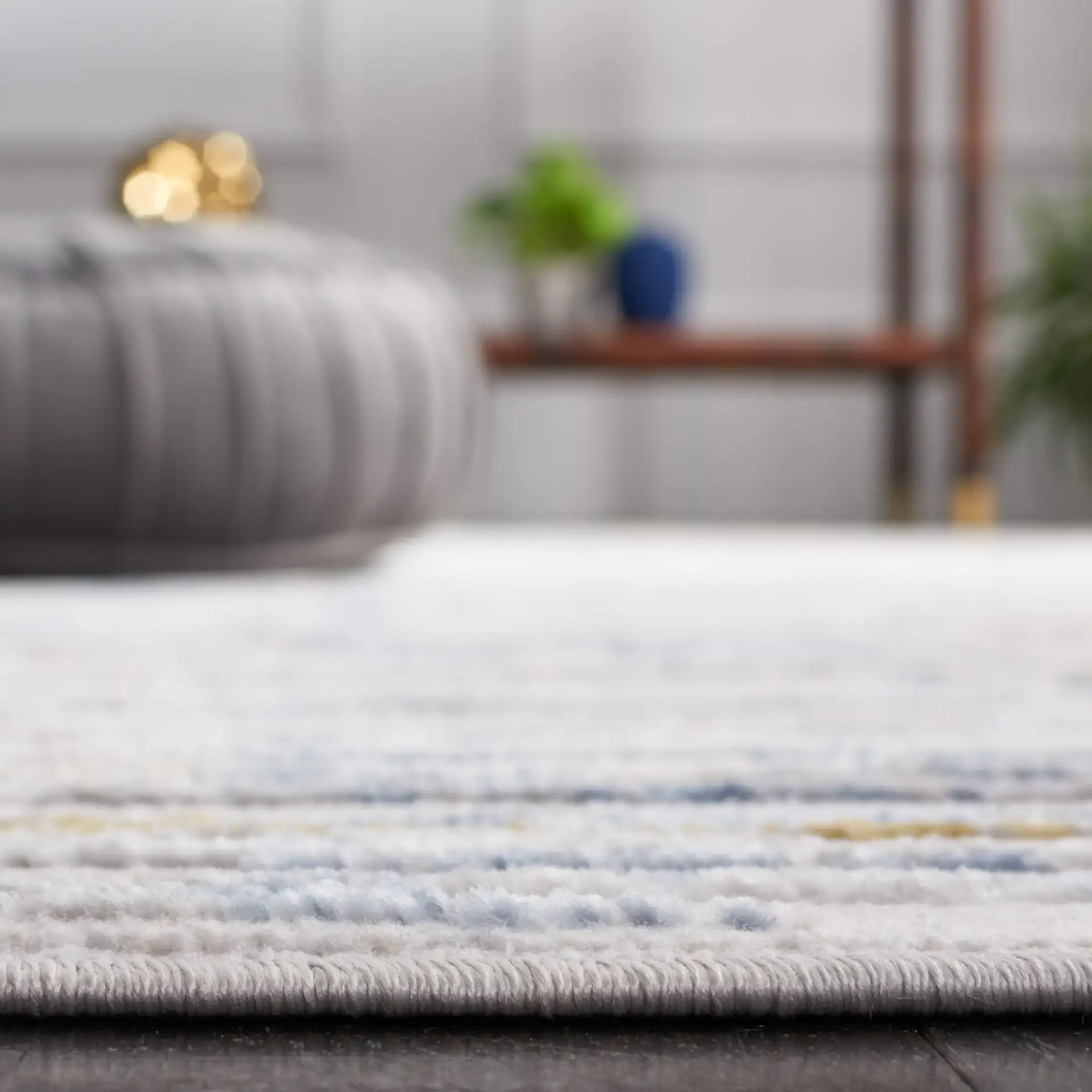 Palma Linear Stripe Rug in Gray / Blue in a styled room