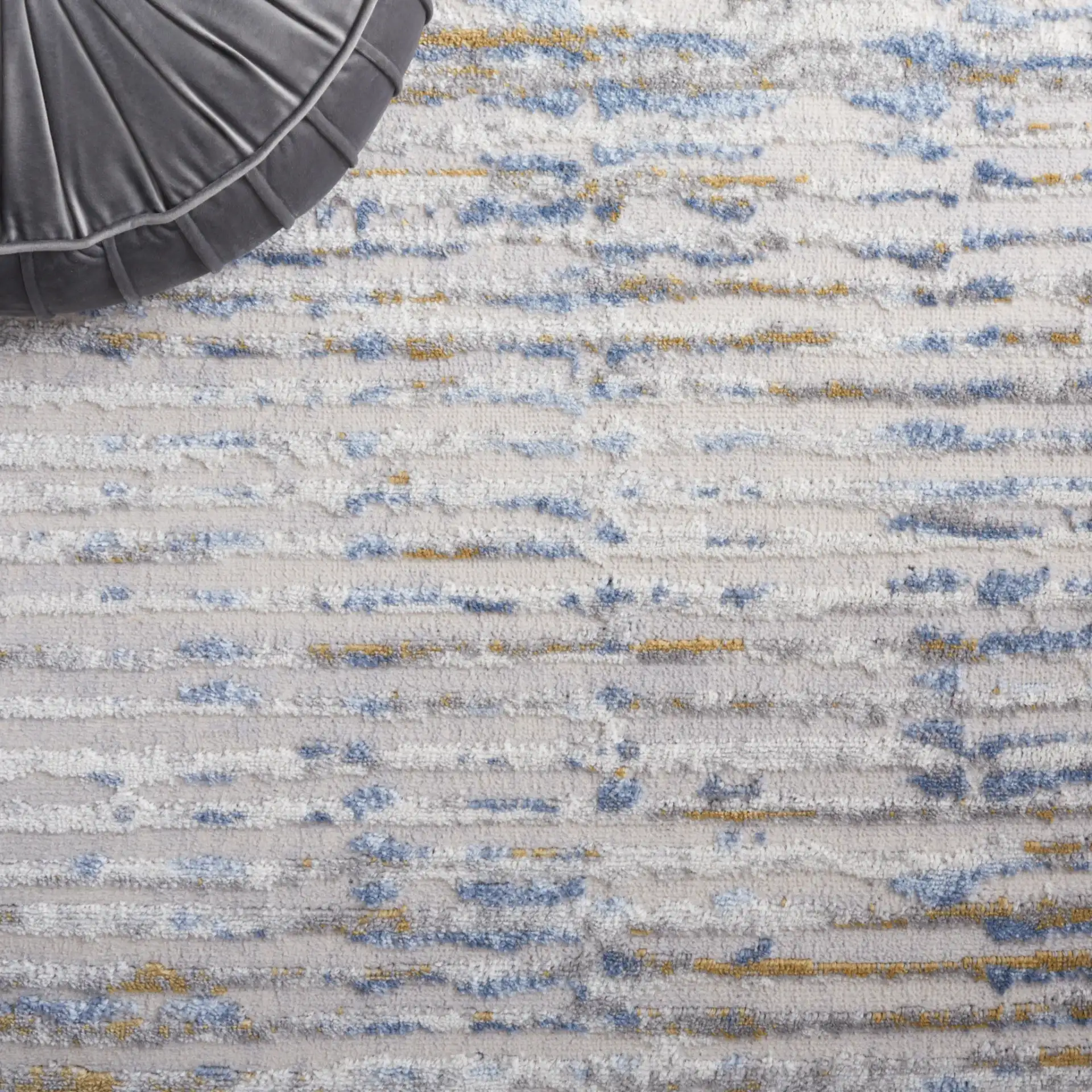 Palma Linear Stripe Rug in Gray / Blue in a styled room