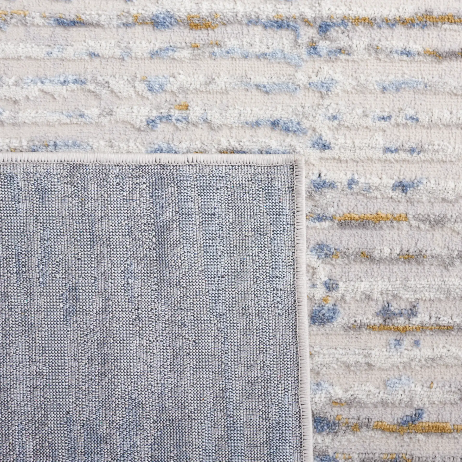 Palma Linear Stripe Rug in Gray / Blue in a styled room