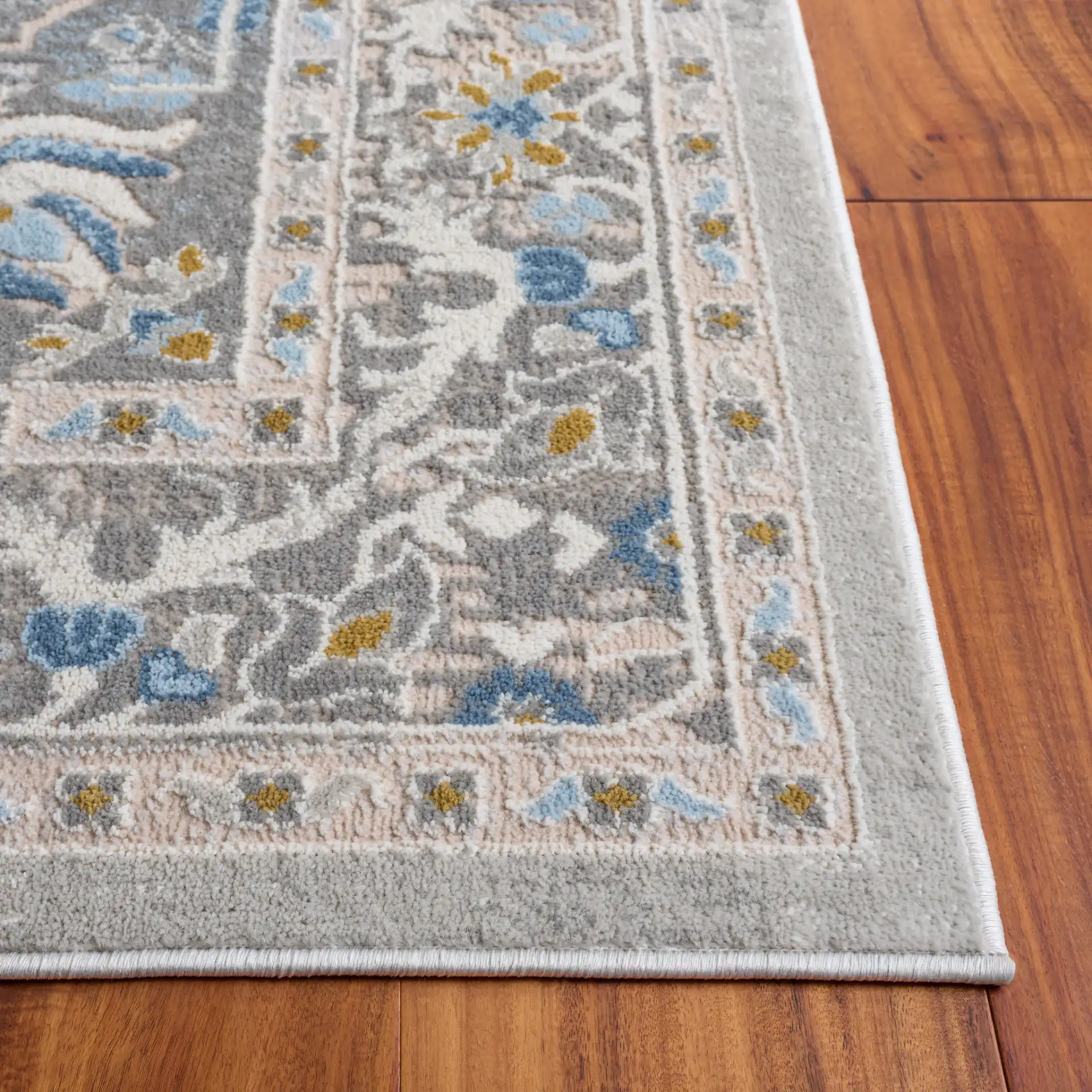 Palma Medallion Bordered Rug in Gray in a styled room