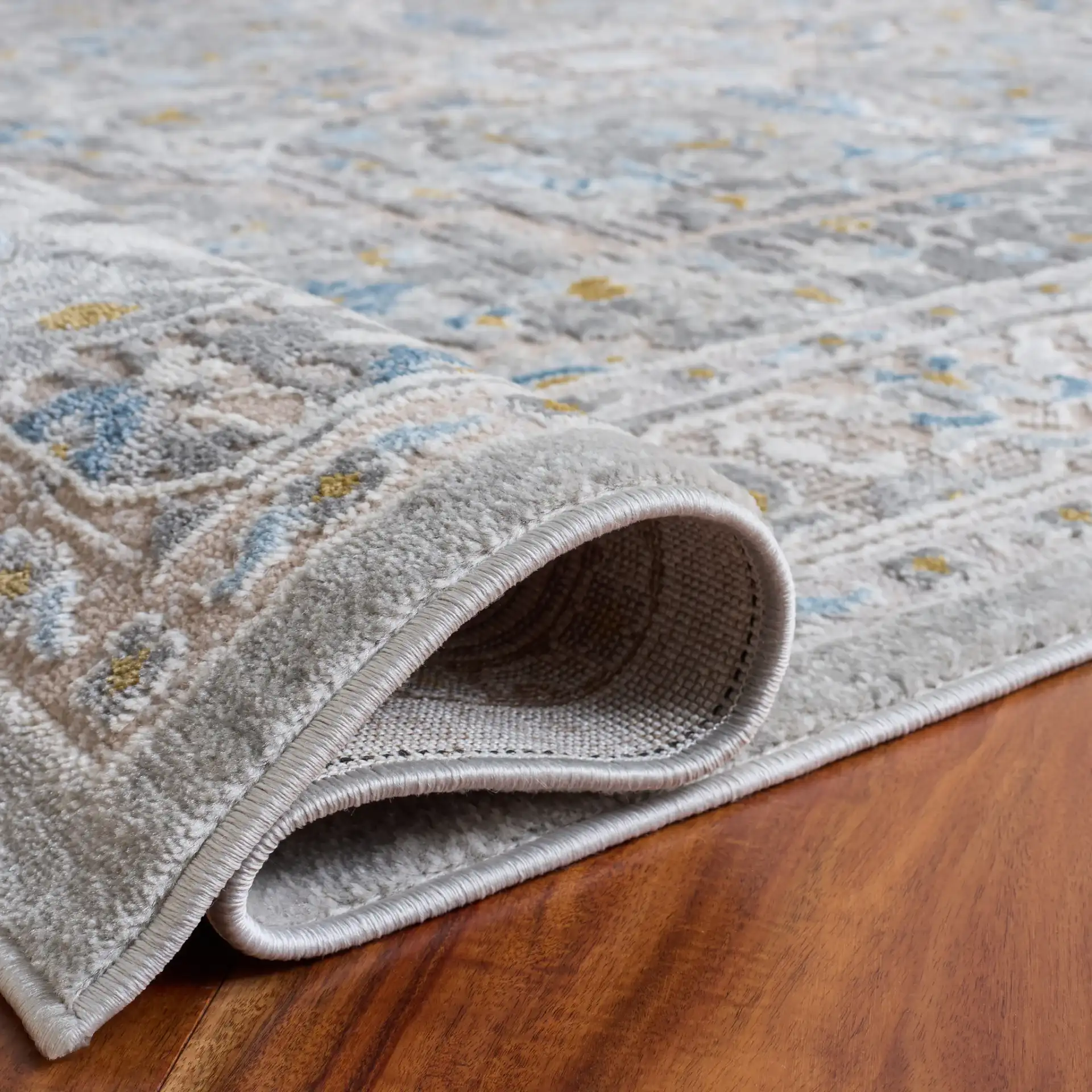 Palma Medallion Bordered Rug in Gray in a styled room