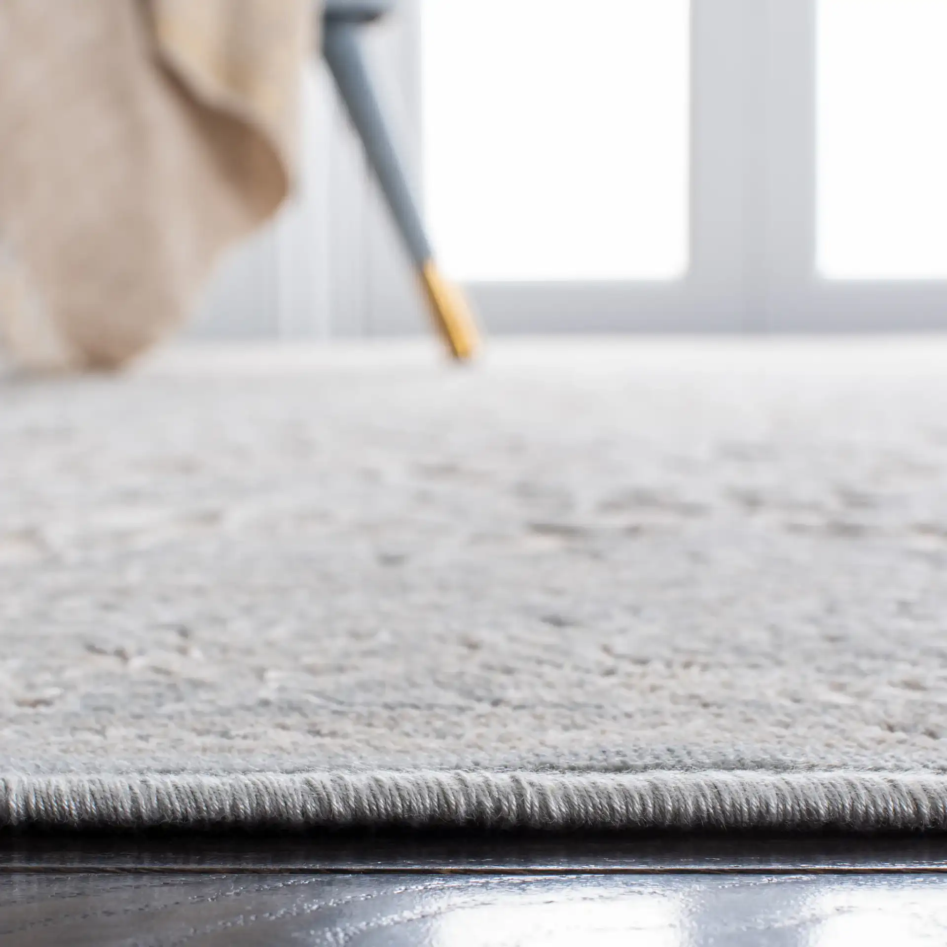 Paradise Damask Bordered Rug in Cream / Slate Blue in a styled room