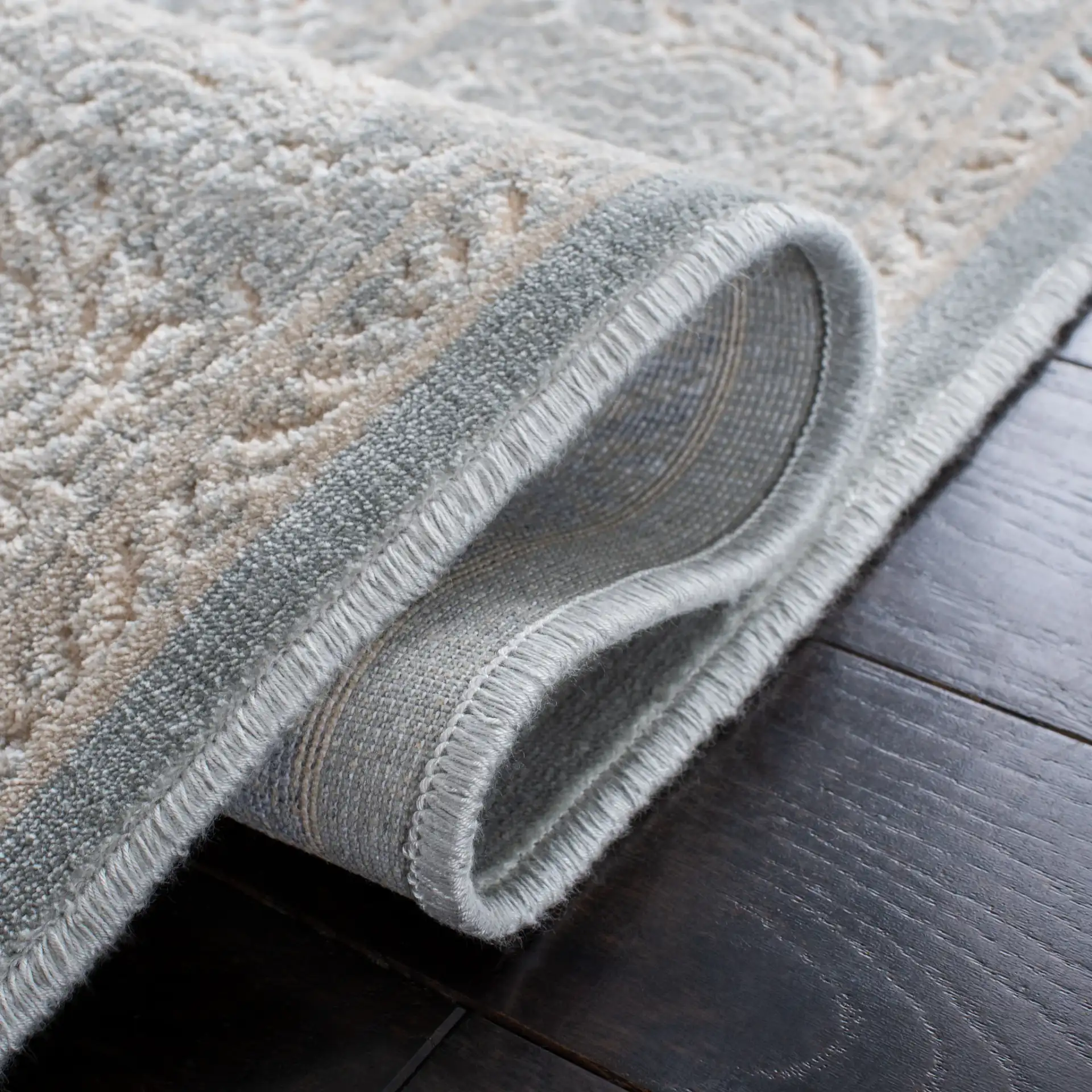 Paradise Damask Bordered Rug in Cream / Slate Blue in a styled room