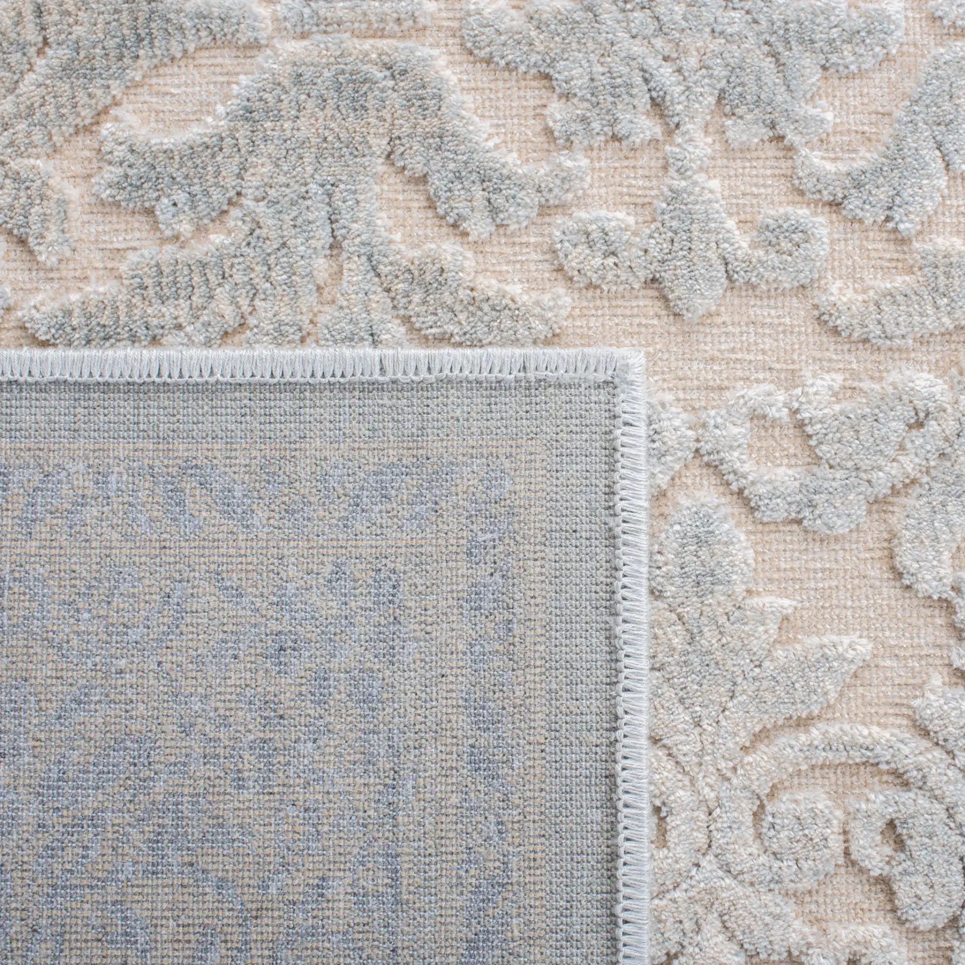 Paradise Damask Bordered Rug in Cream / Slate Blue in a styled room