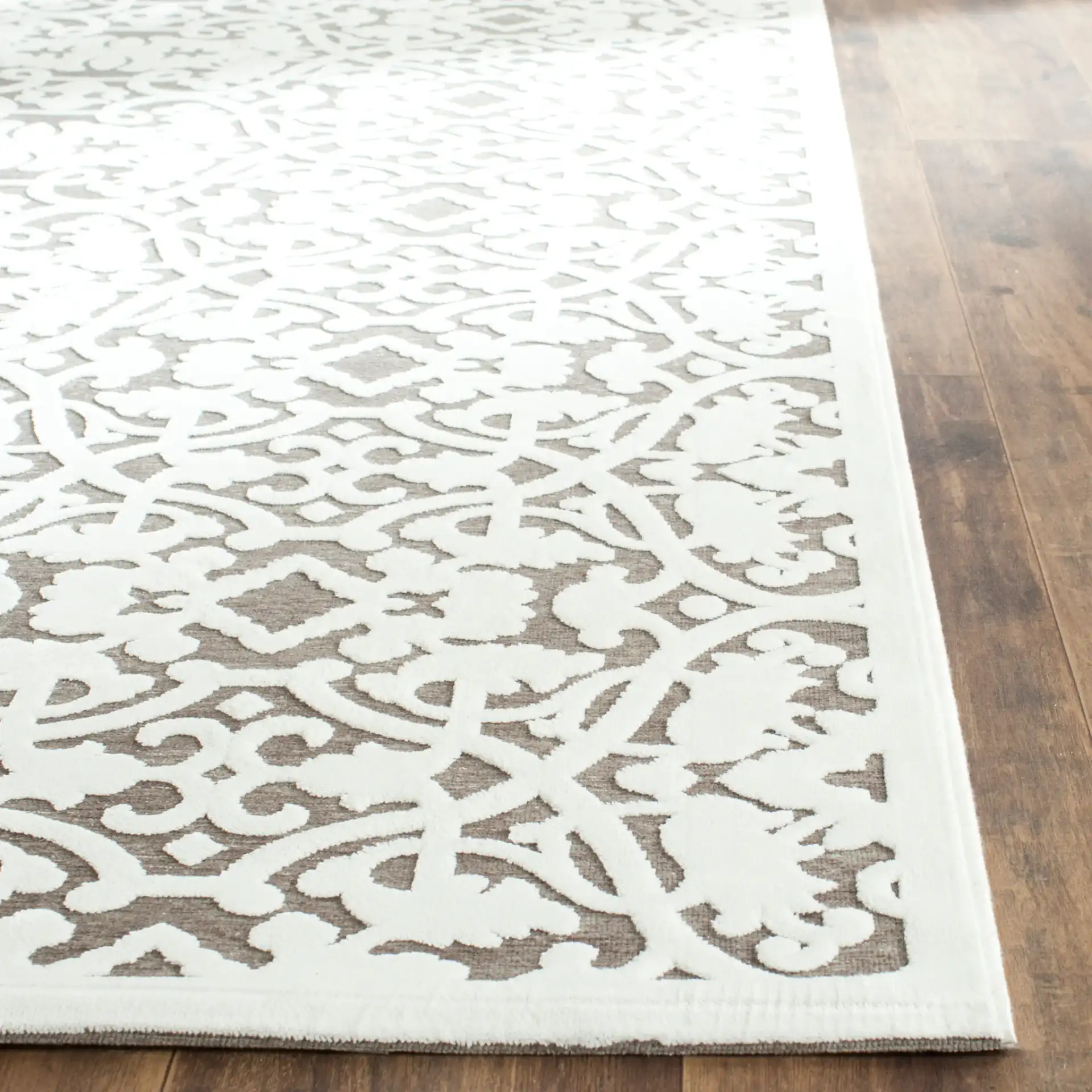 Paradise Interlocking Scroll Rug in Ivory / Dark Gray in a styled room