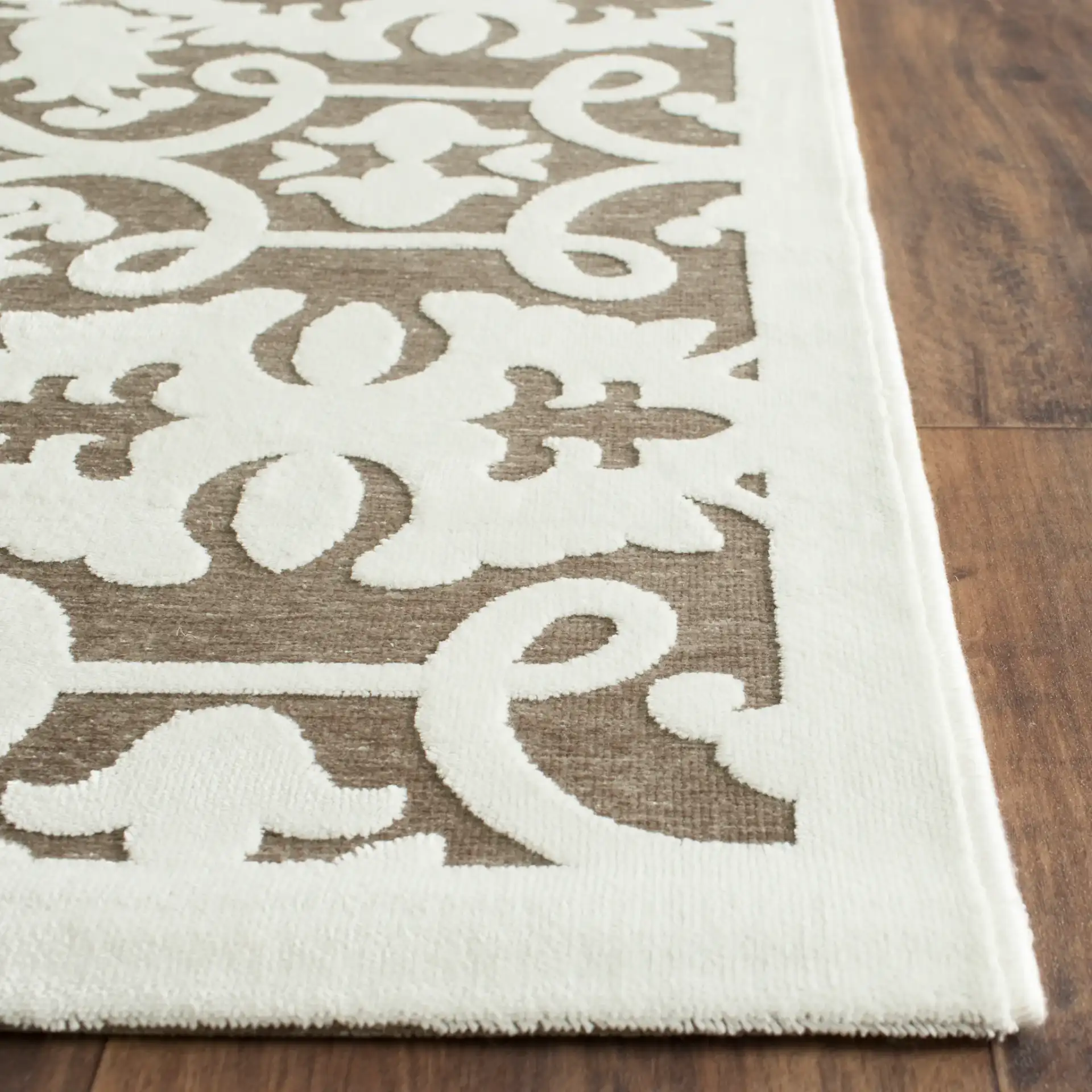 Paradise Interlocking Scroll Rug in Ivory / Dark Gray in a styled room