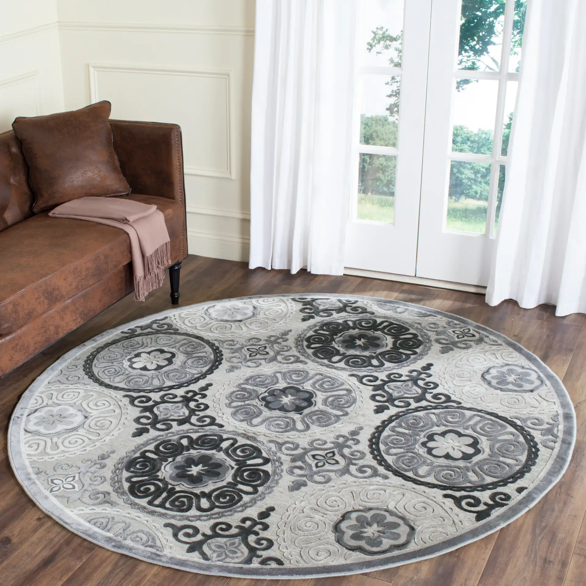 Paradise Circular Medallion Rug in Light Gray / Dark Gray in a styled room