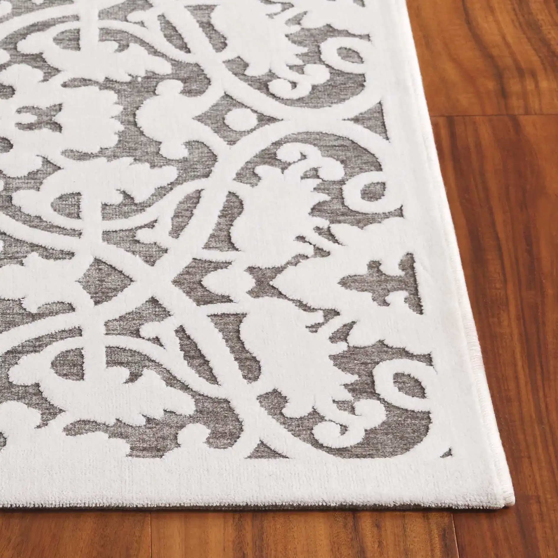Paradise Interlocking Vine Rug in Ivory / Dark Gray in a styled room
