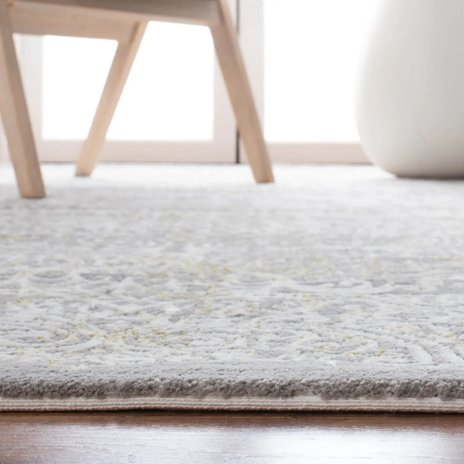 Passion Distressed Scroll Medallion Rug in Gray / Green in a styled room