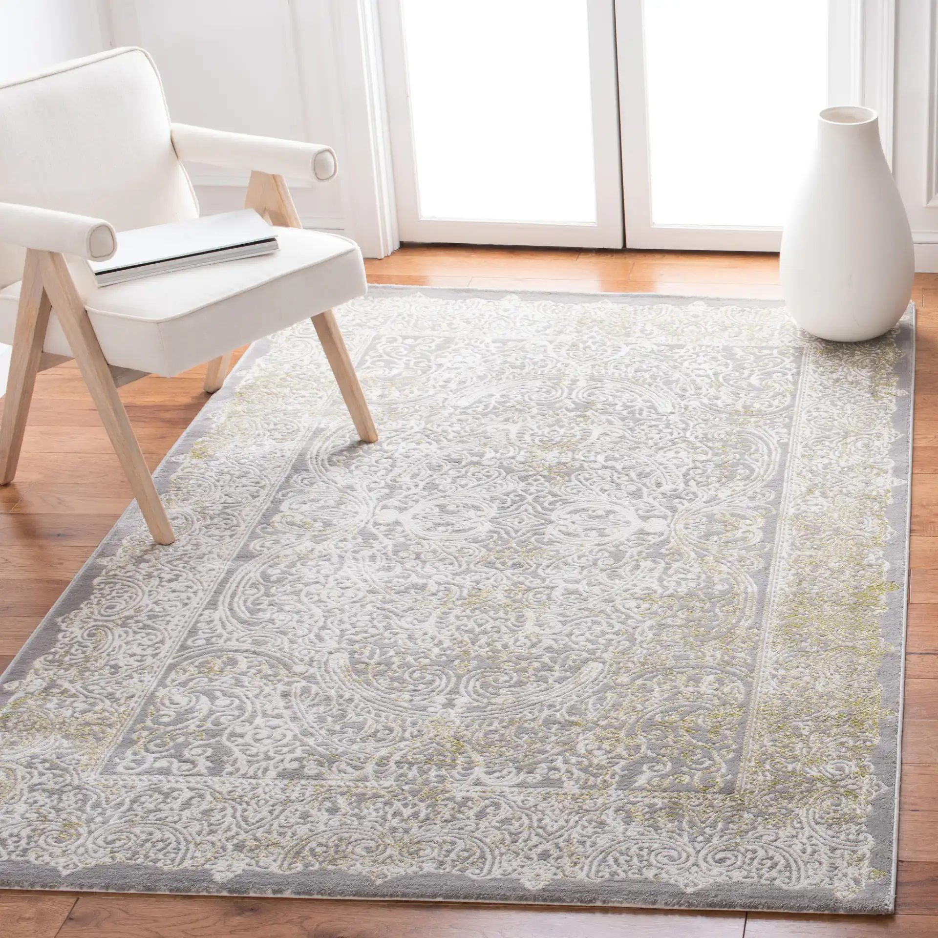 Passion Distressed Scroll Medallion Rug in Gray / Green in a styled room