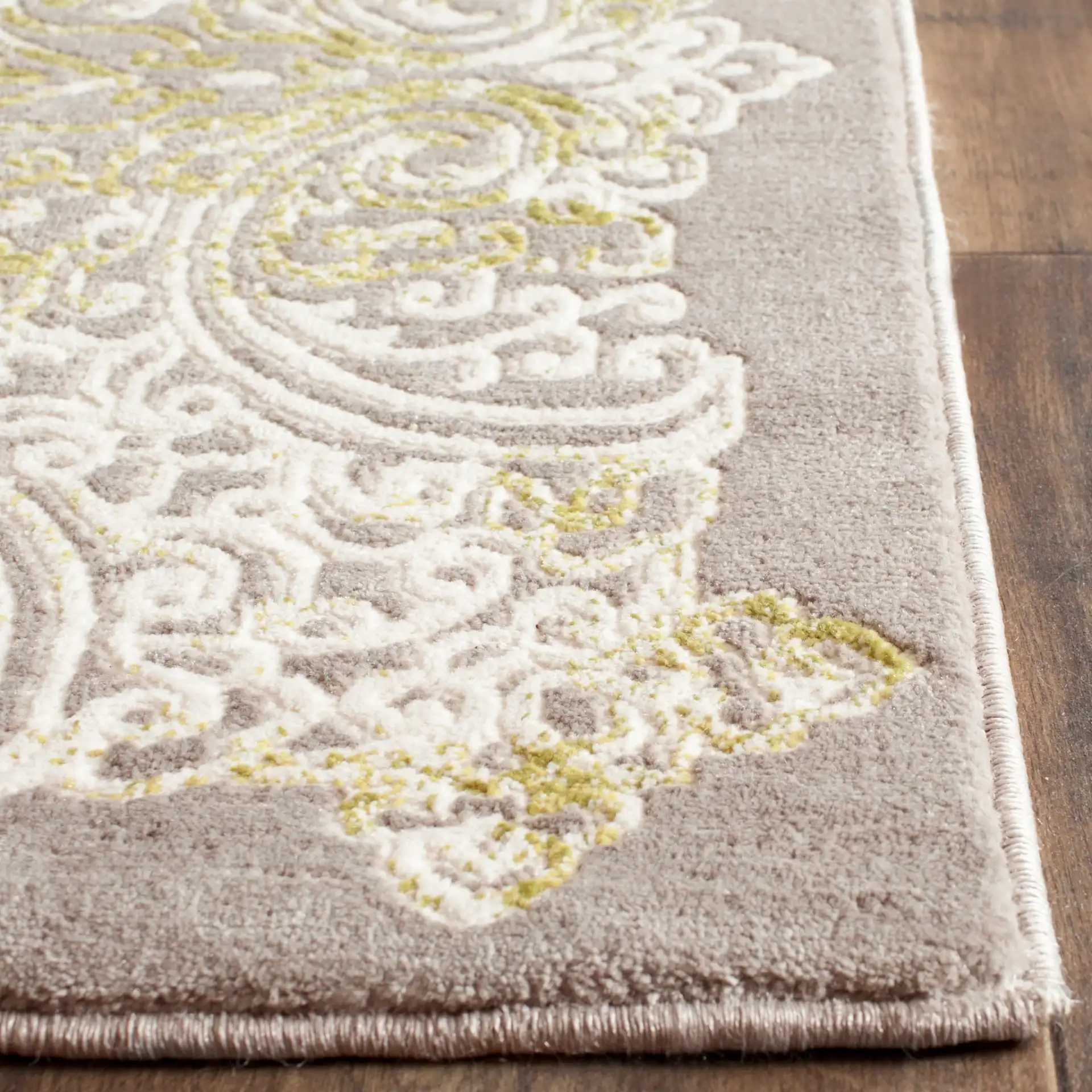 Passion Distressed Scroll Medallion Rug in Gray / Green in a styled room