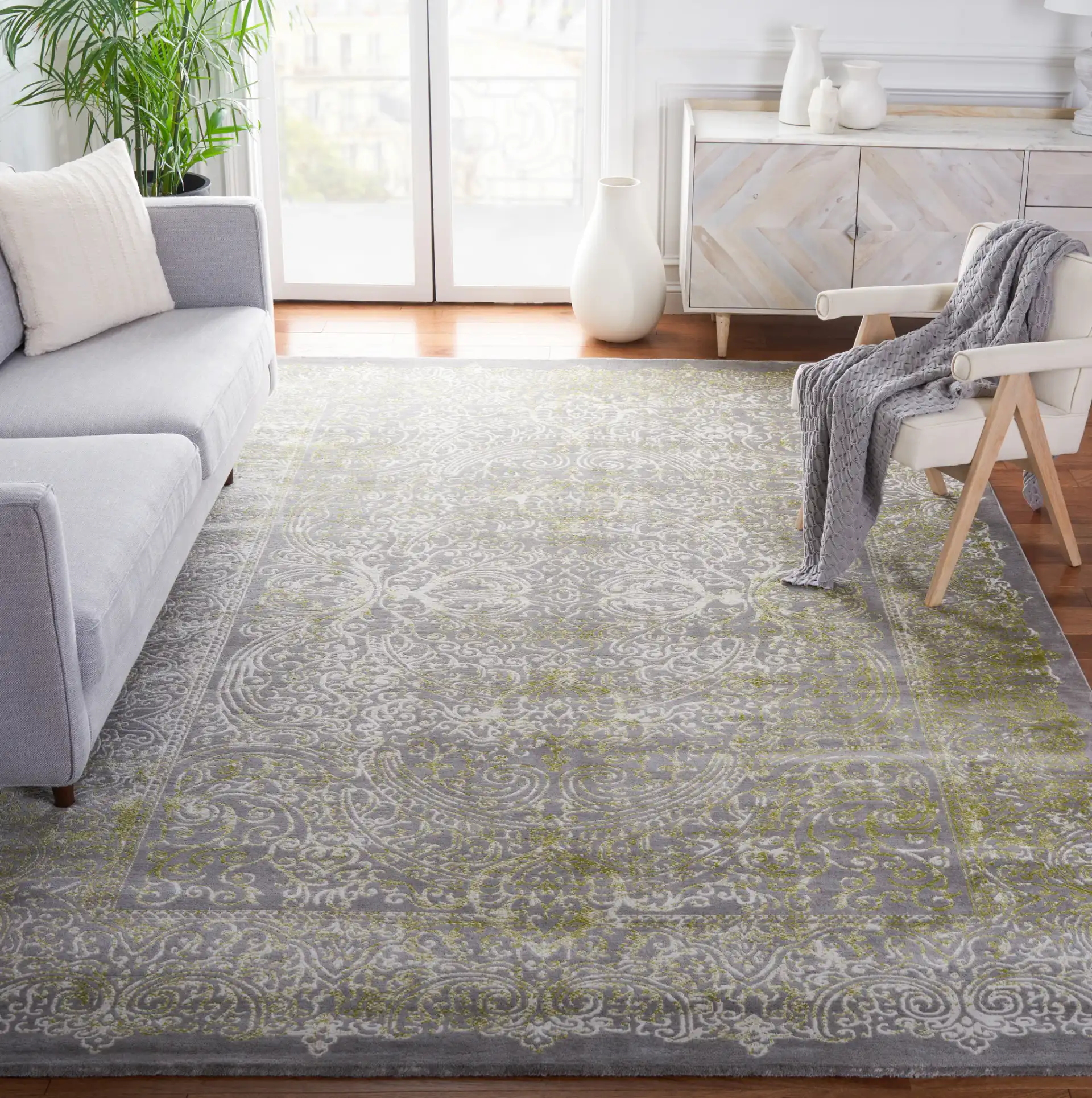 Passion Distressed Scroll Medallion Rug in Gray / Green in a styled room