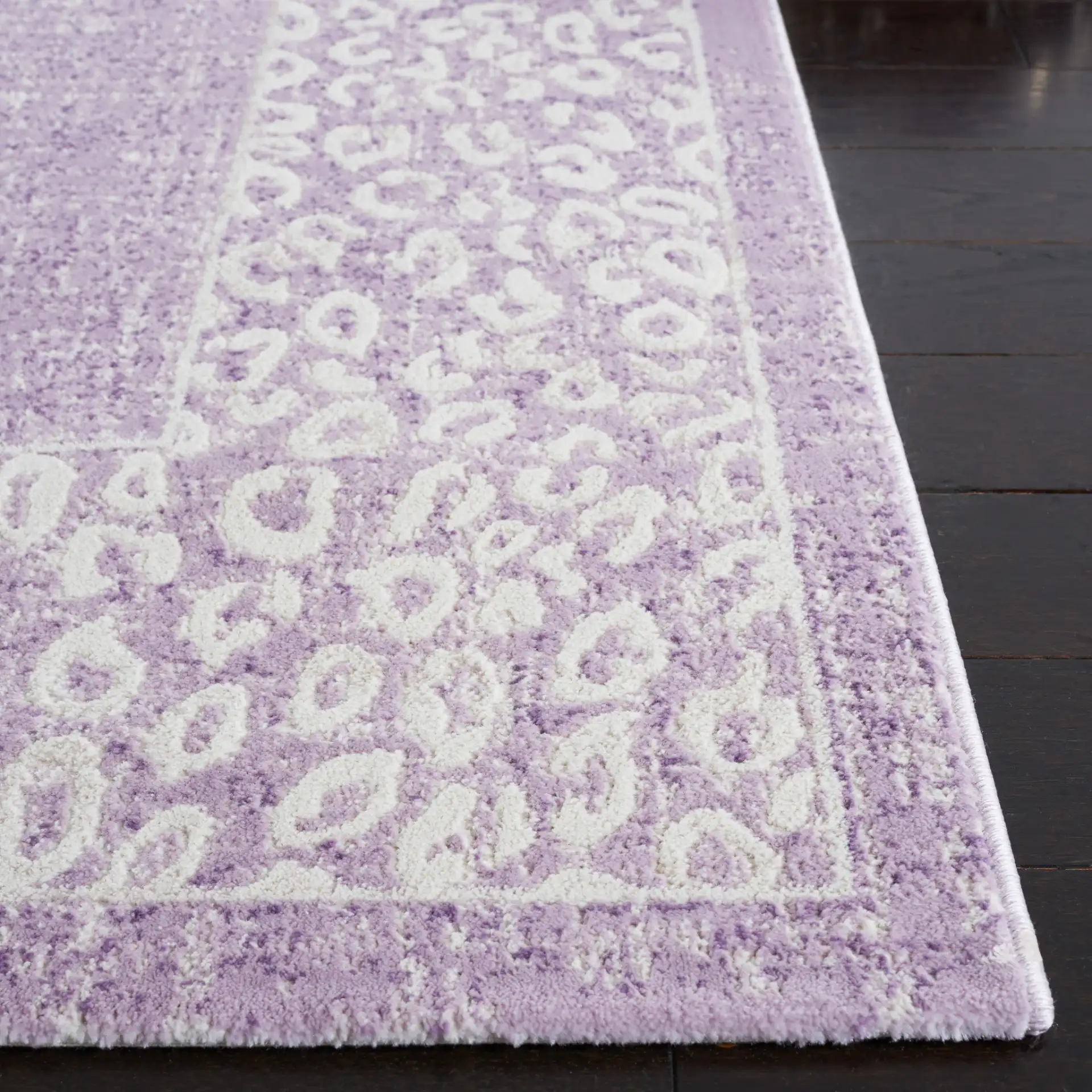 Passion Glam Leopard Border Rug in Purple / Beige in a styled room