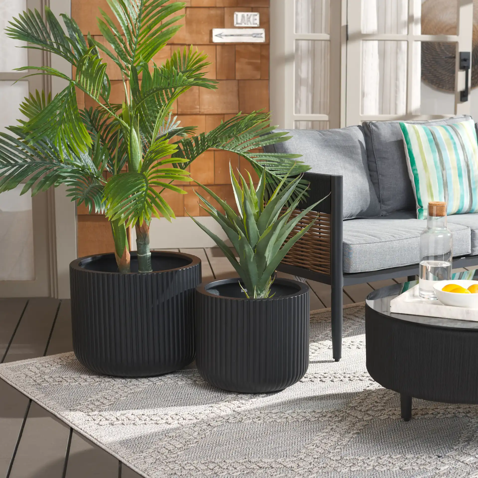 Lucca Planter Pot (Set Of 2) in Black in a styled room