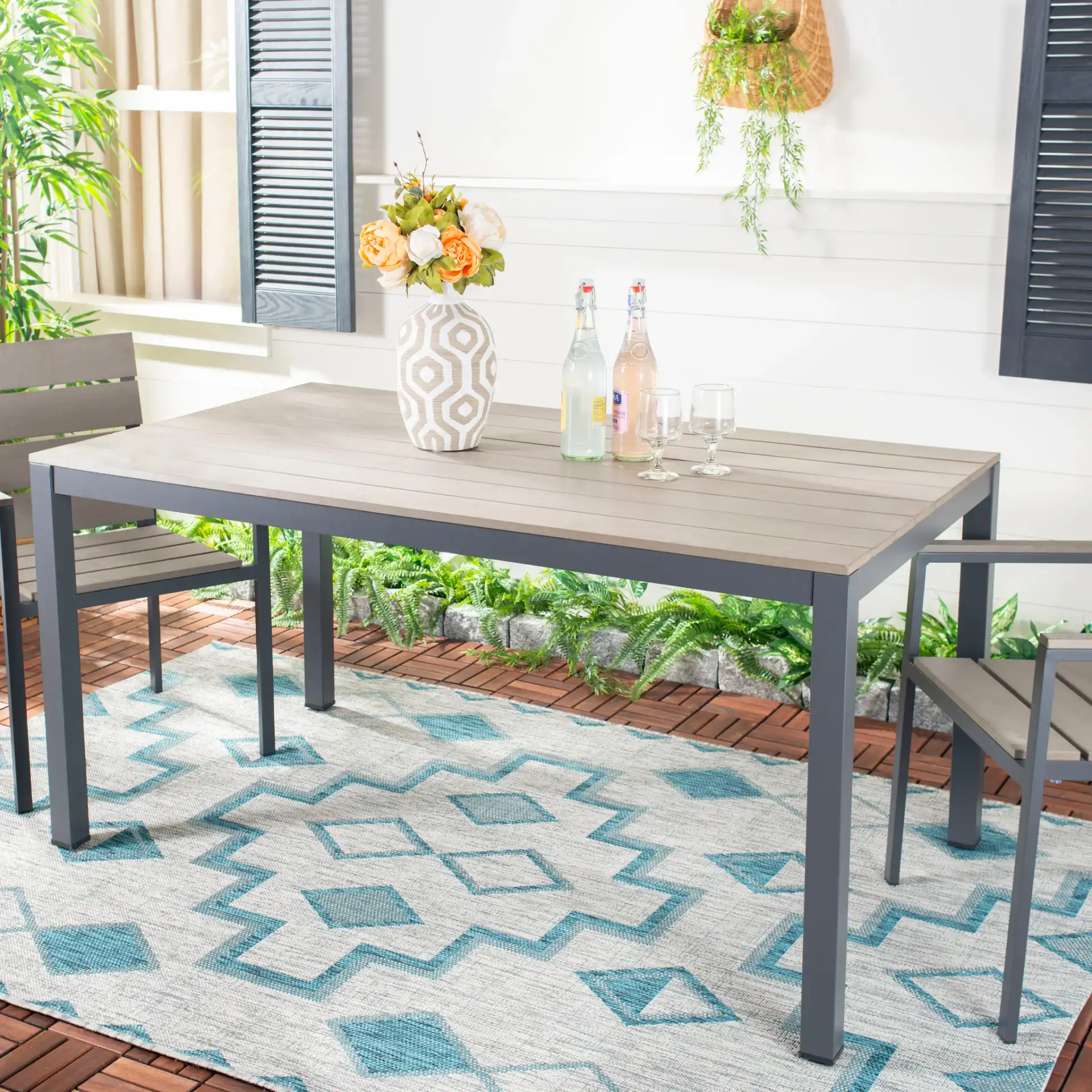 Beldan Dining Table in Distressed Taupe in a styled room