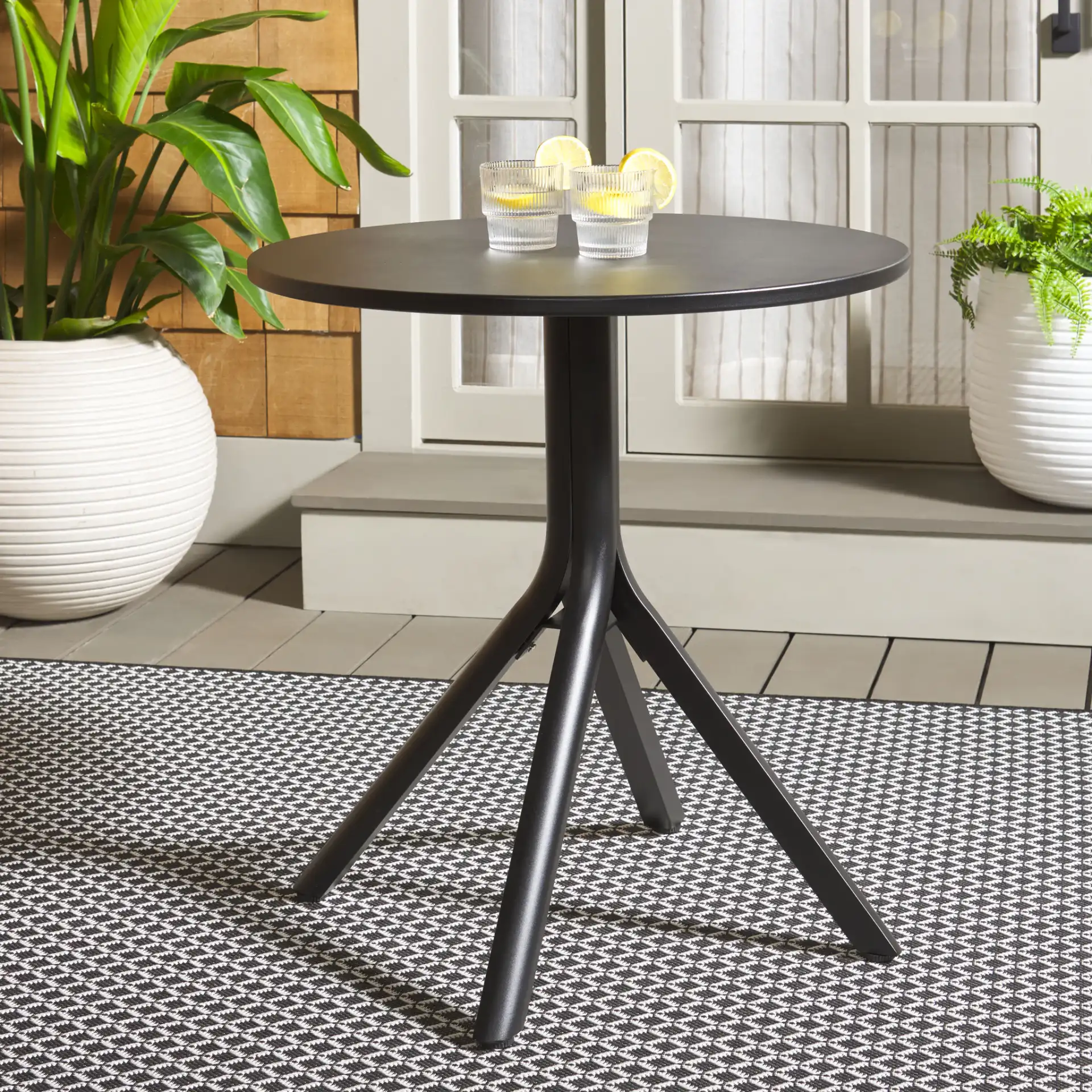Core Bistro Table in Black in a styled room