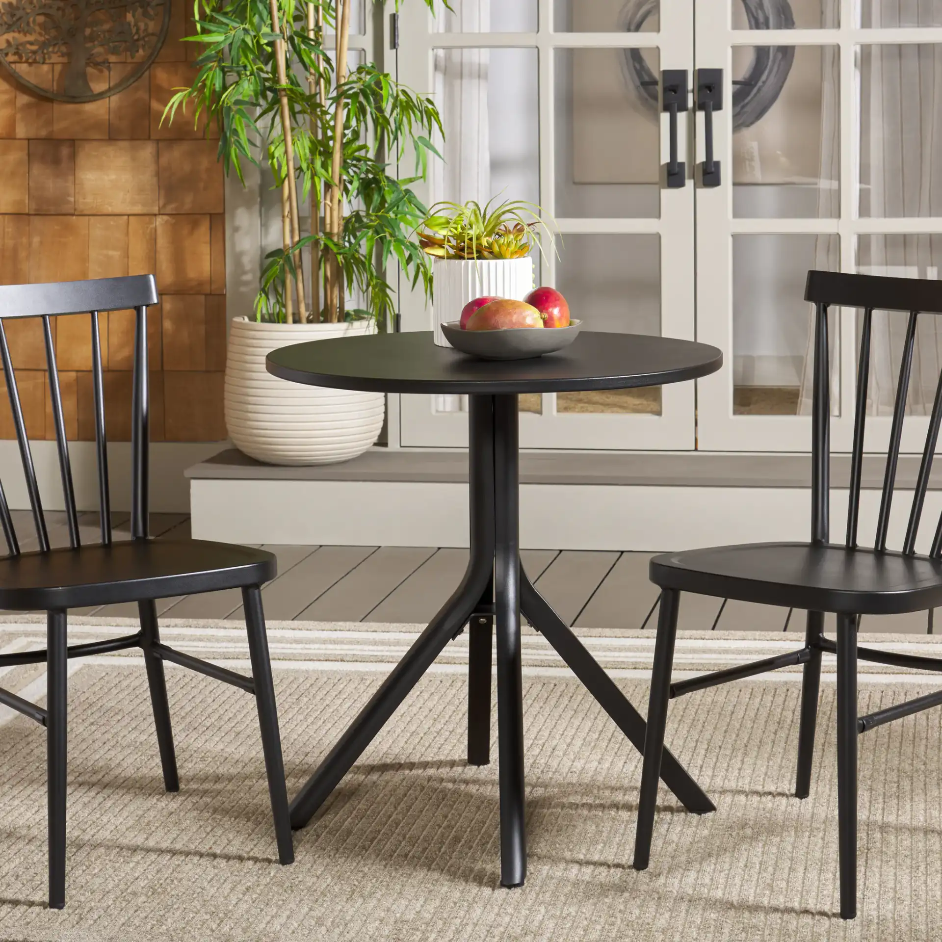 Core Bistro Table in Black in a styled room