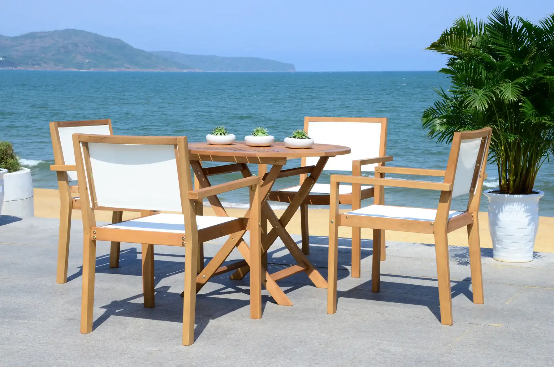 Chante Round Table Five-Piece Set in Natural in a styled room