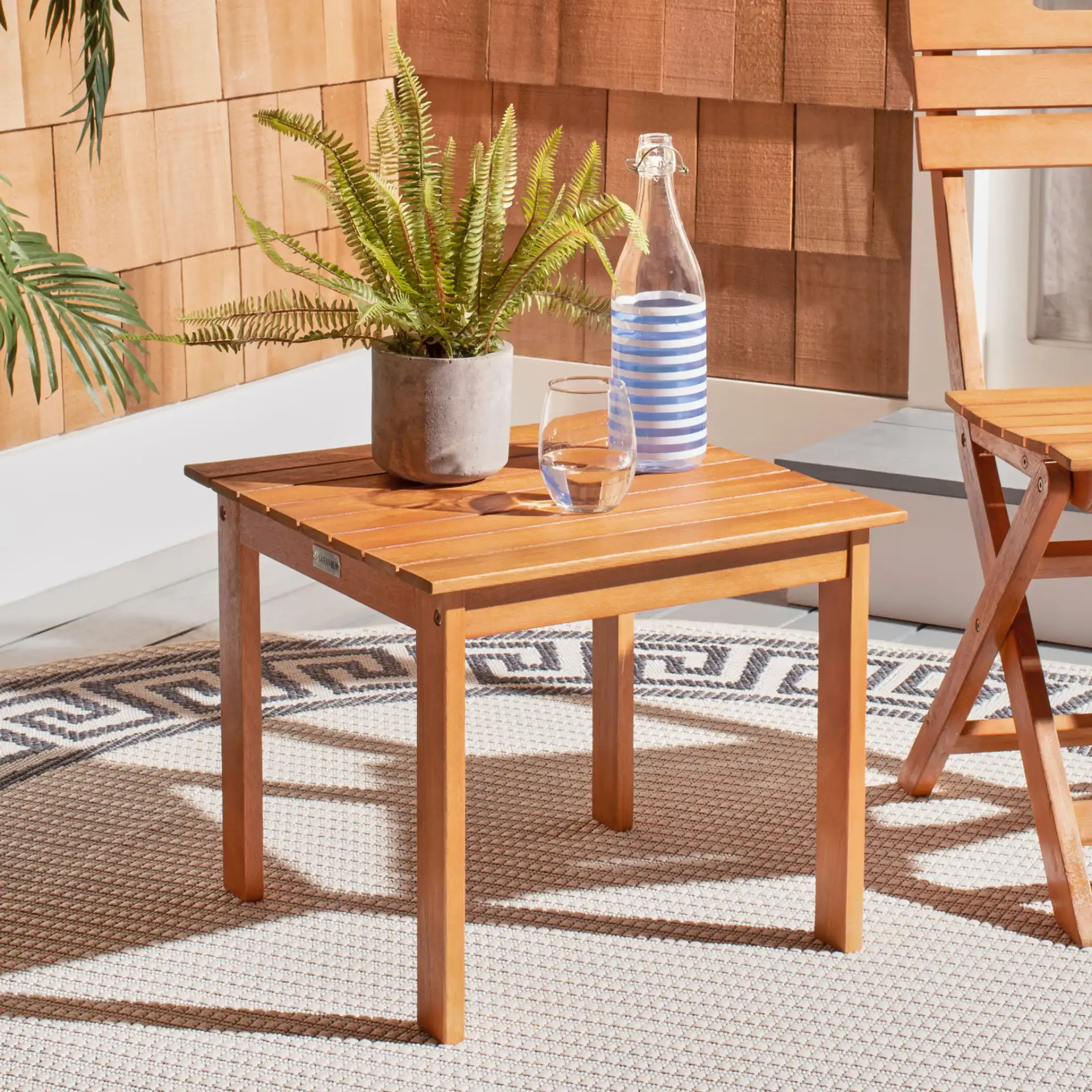 Randor Folding Table in Natural in a styled room