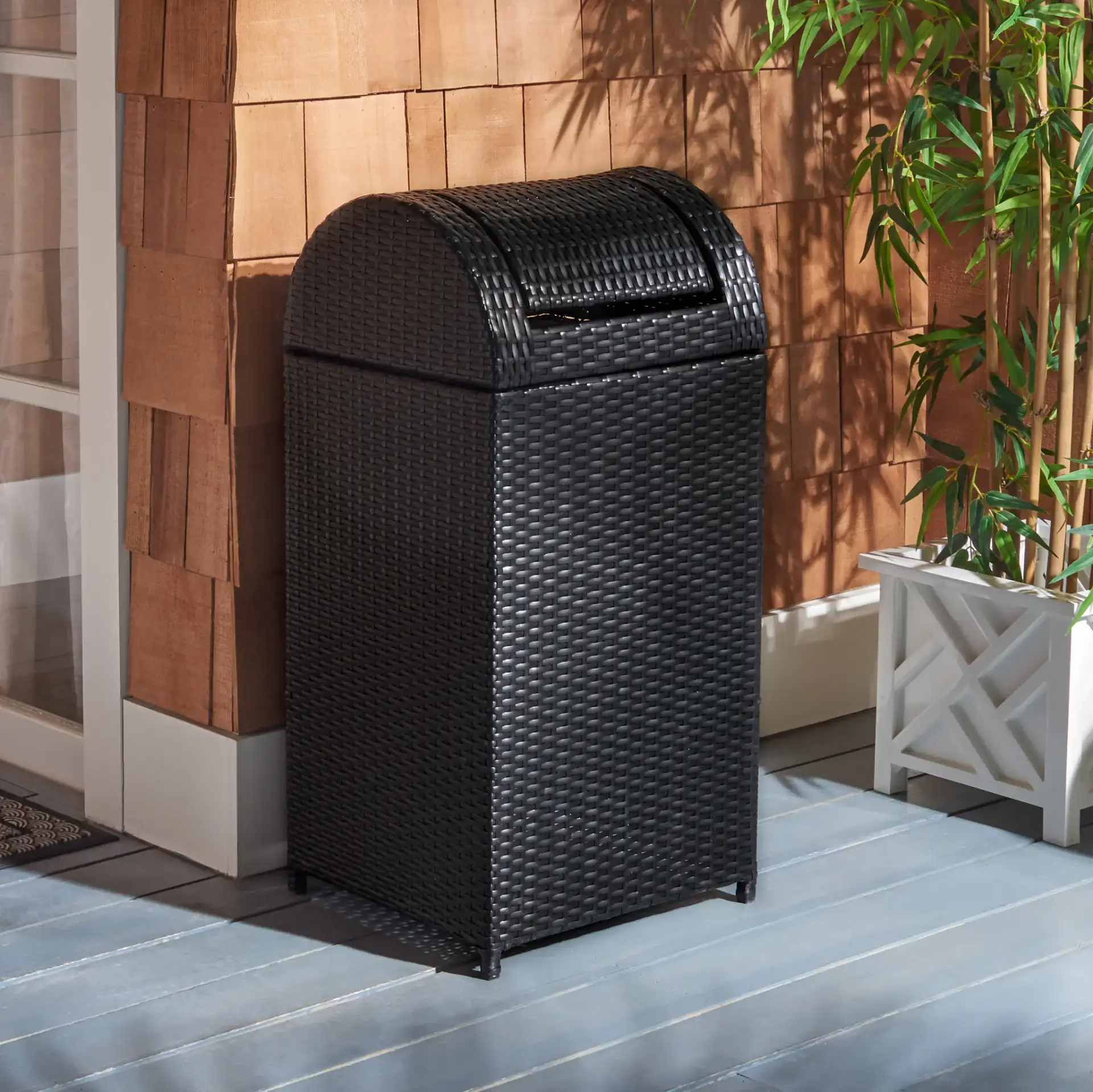 Serapis Trash Bin in Black in a styled room